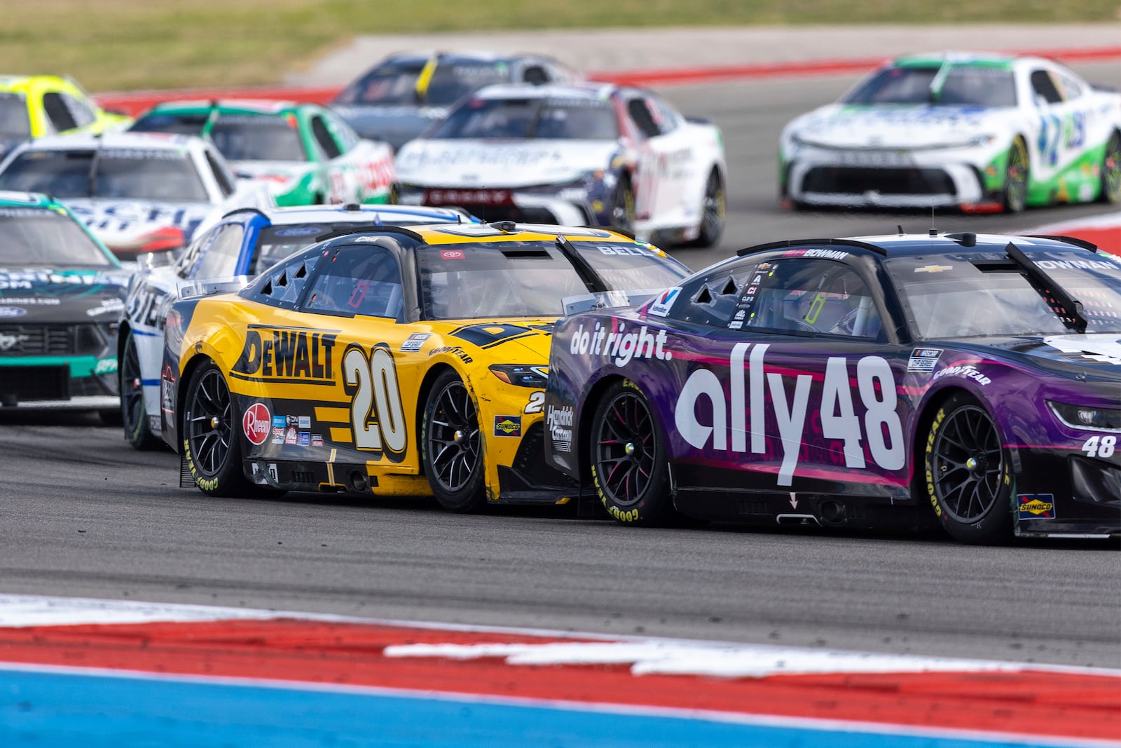 Christopher Bell (20) follows Alex Bowman (48) during a NASCAR Cup Series auto race at Circuit of the Americas in Austin, Texas, Sunday, March 2, 2025. (AP Photo/Stephen Spillman)