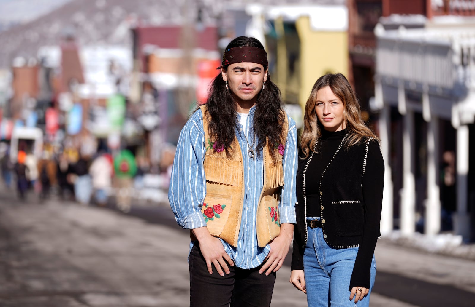 Julian Brave NoiseCat, left, and Emily Kassie, co-directors of the Oscar-nominated documentary film "Sugarcane," pose for a portrait on Main Street during the Sundance Film Festival on Monday, Jan. 27, 2025, in Park City, Utah. (AP Photo/Chris Pizzello)