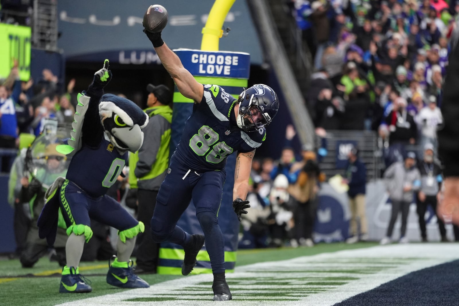 Seattle Seahawks tight end AJ Barner (88) celebrates after catching a 4-yard touchdown pass during the second half of an NFL football game against the Minnesota Vikings, Sunday, Dec. 22, 2024, in Seattle. (AP Photo/Lindsey Wasson)