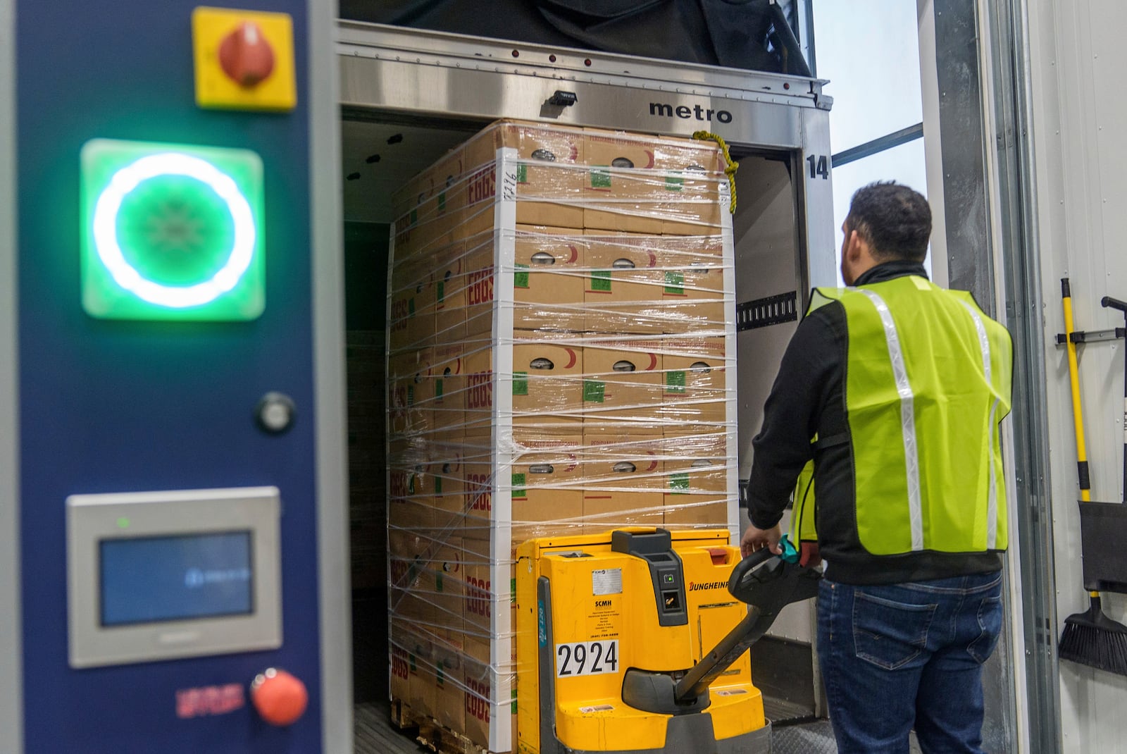 Rosemary Farm's driver Jose Pelayo unloads a truck with some of the hundreds of thousands of fresh eggs donated to feed first responders and those in need in the community through the donation of Rosemary Eggs at the Los Angeles Food Regional Bank in City of Industry, Calif., Wednesday, Feb. 12, 2025. (AP Photo/Damian Dovarganes)