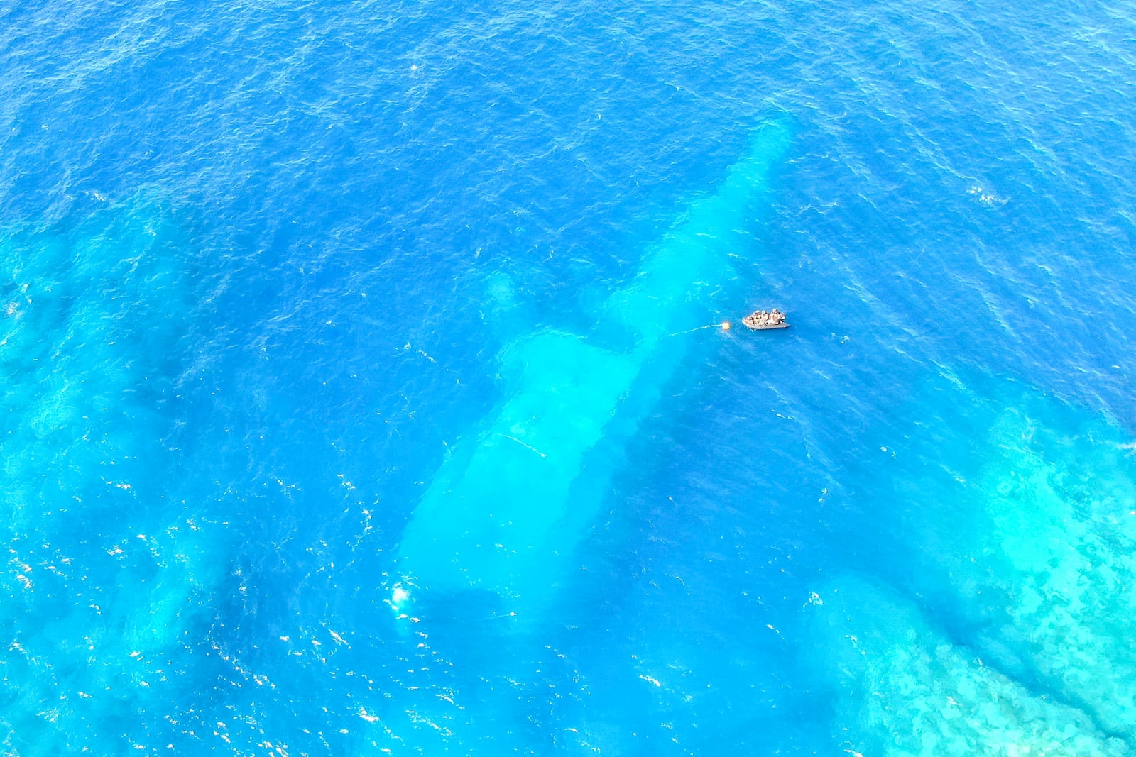 FILE - In this photo provided by the New Zealand Defence Force, divers survey the area around HMNZS Manawanui on the southern coast of Upulo, Samoa, after the Manawanui ran aground and sank on Oct. 6. (AC Jese Somerville/New Zealand Defence Force via AP,File)