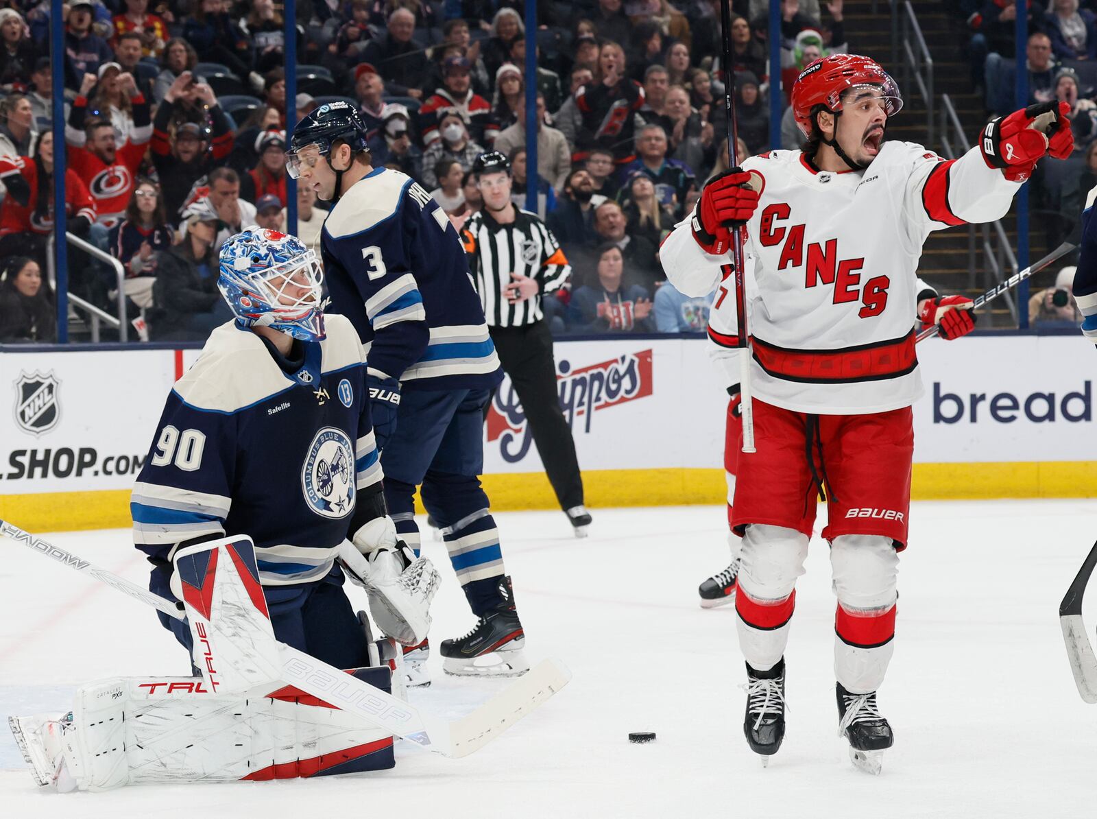 Carolina Hurricanes' Seth Jarvis, right, celebrates after a goal against the Columbus Blue Jackets during the first period of an NHL hockey game Tuesday, Dec. 31, 2024, in Columbus, Ohio. (AP Photo/Jay LaPrete)