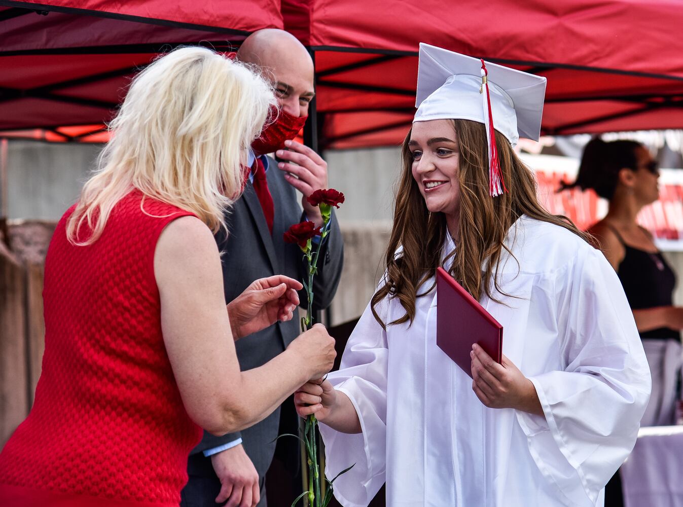 Madison High School drive-thru graduation ceremony at Land of Illusion