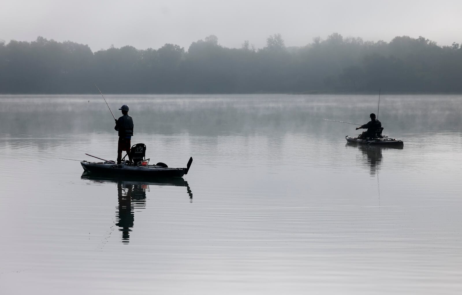 Steve Meddings, from Maineville, fishes with his son, Kyle Meddings, 12, at Marsh Park in Fairfield Tuesday, Sept. 20, 2022. NICK GRAHAM/STAFF