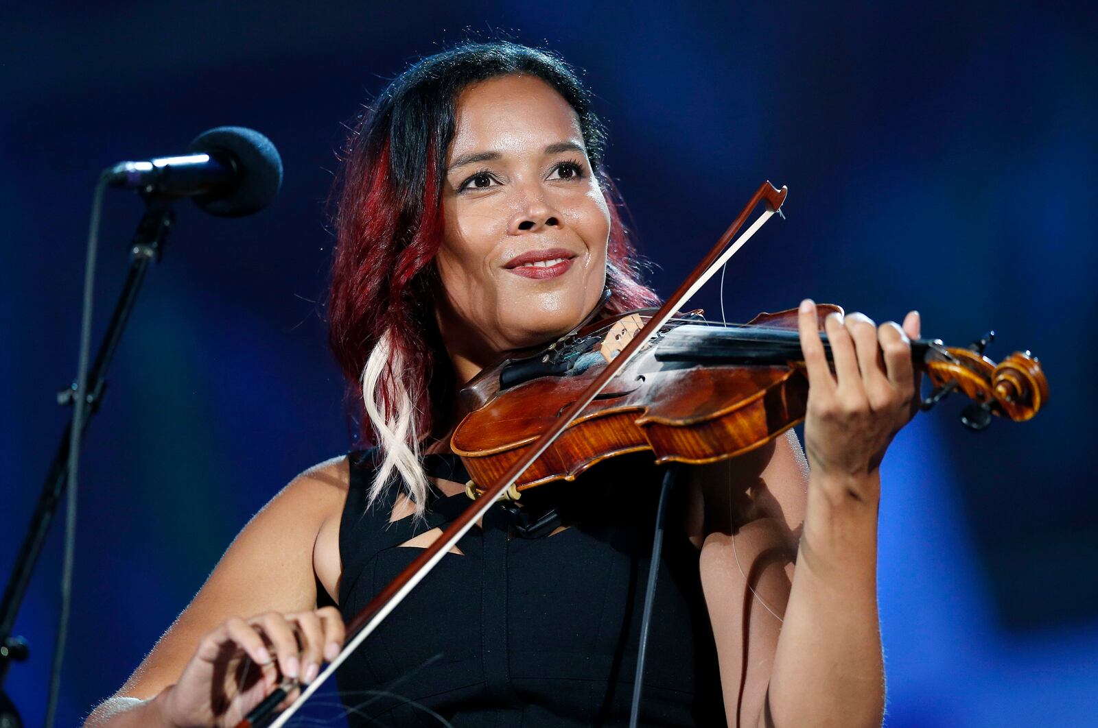 FILE - Rhiannon Giddens performs during rehearsal for the Boston Pops Fireworks Spectacular in Boston, on July 3, 2018. (AP Photo/Michael Dwyer, File)