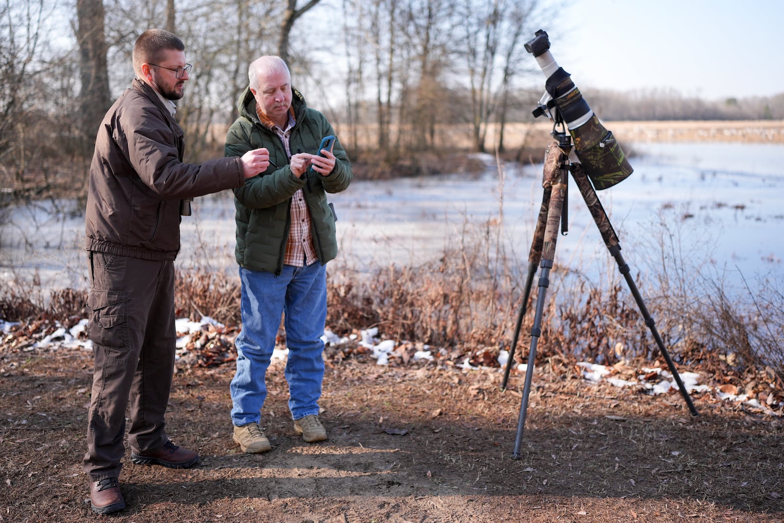 Park ranger David Young, left, talks to Rob Broeren, right, at the Wheeler National Wildlife Refuge, Monday, Jan. 13, 2025, in Decatur, Ala. (AP Photo/George Walker IV)