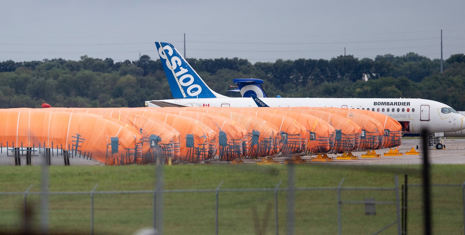 FILE - In this Oct. 3, 2019, photo completed Boeing 737 MAX fuselages, made at Spirit Aerosystems in Wichita, Kan., sit covered in tarps near the factory. (Travis Heying/The Wichita Eagle via AP, File)