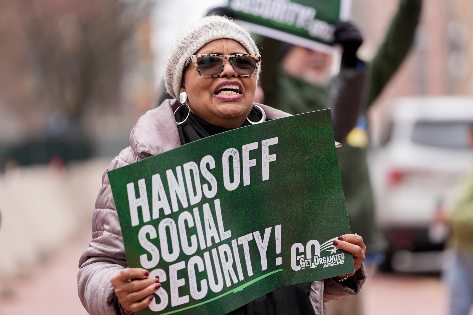 Demonstrators gather outside of the Edward A. Garmatz United States District Courthouse in Baltimore, on Friday, March 14, 2025, before a hearing regarding the Department of Government Efficiency's access to Social Security data. (AP Photo/Stephanie Scarbrough)