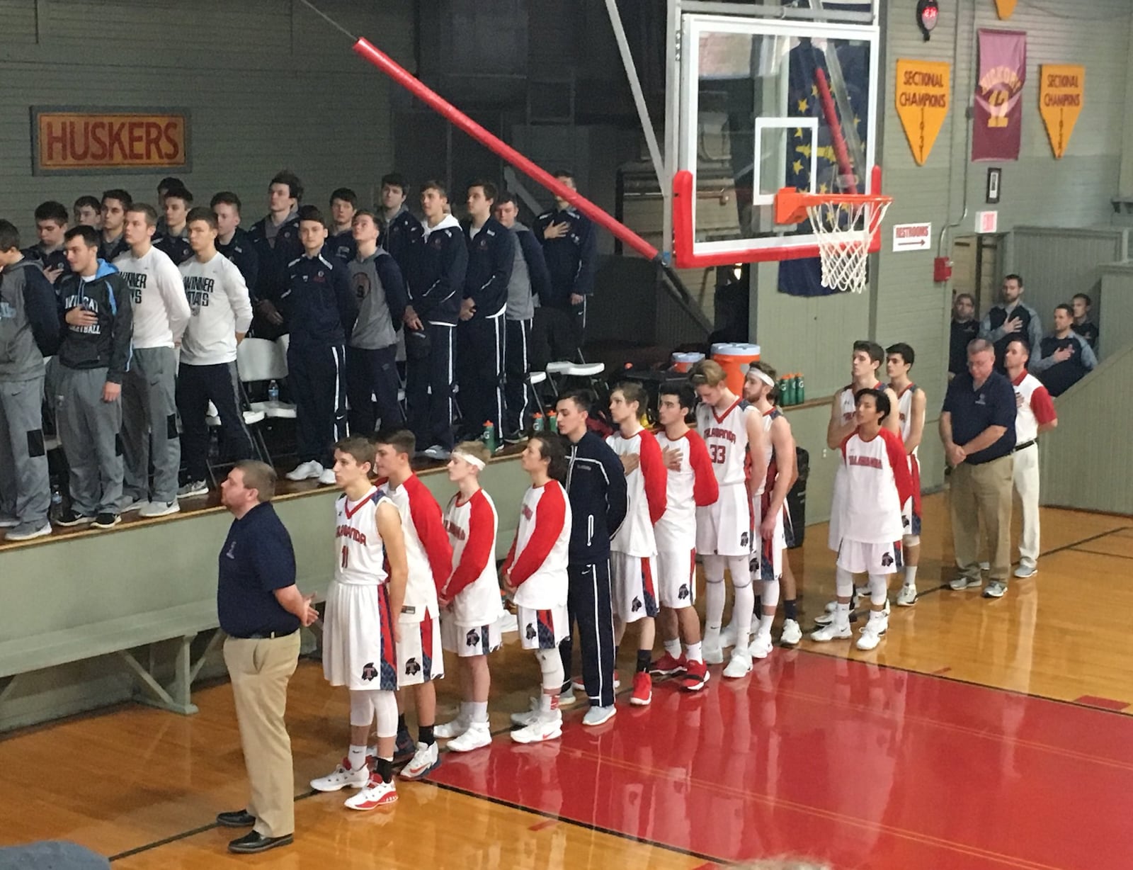 The Talawanda team stands during the National Anthem before Saturday afternoon’s game against Franklin County (Ind.) at the Hoosier Gym in Knightstown, Ind. RICK CASSANO/STAFF