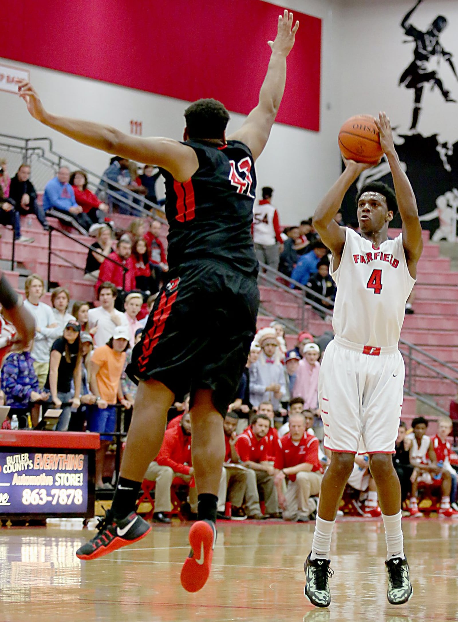 Fairfield forward Devonte Ross shoots over Colerain’ss Tahj Roberts on Tuesday night at Fairfield Arena. CONTRIBUTED PHOTO BY E.L. HUBBARD