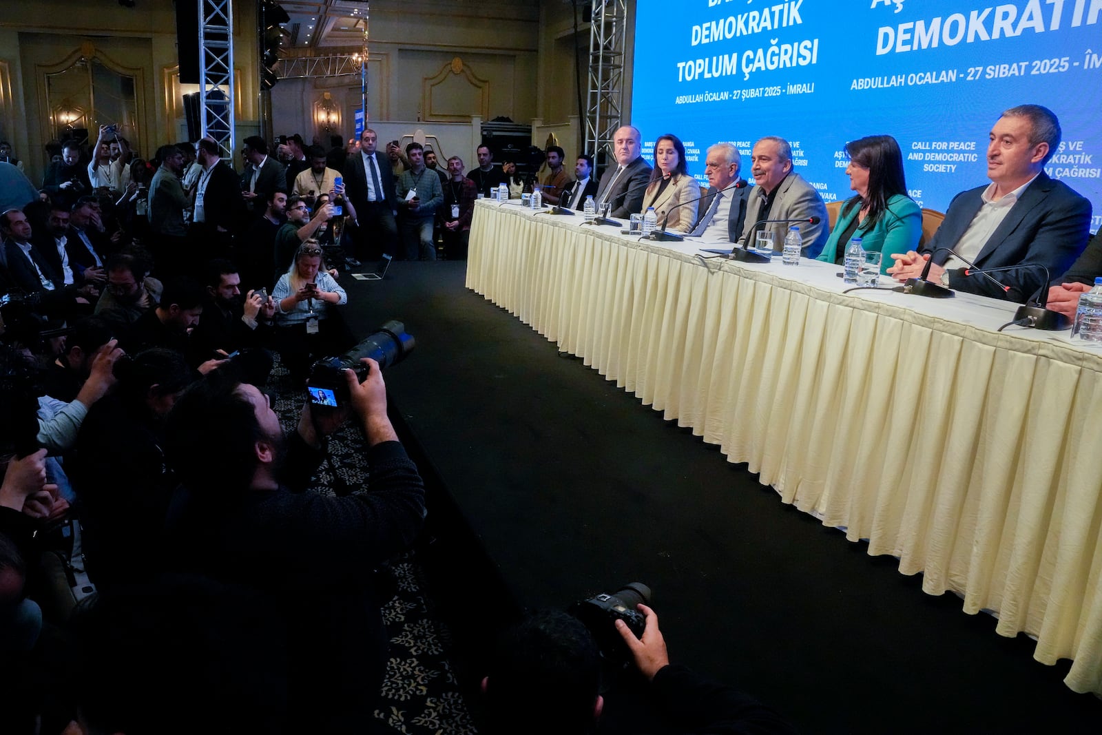 Pro-Kurdish Peoples' Equality and Democracy Party, or DEM, delegation members release an statement from the jailed leader of the rebel Kurdistan Workers' Party, or PKK, Abdullah Ocalan, in Istanbul, Turkey, Thursday, Feb. 27, 2025. (AP Photo/Khalil Hamra)