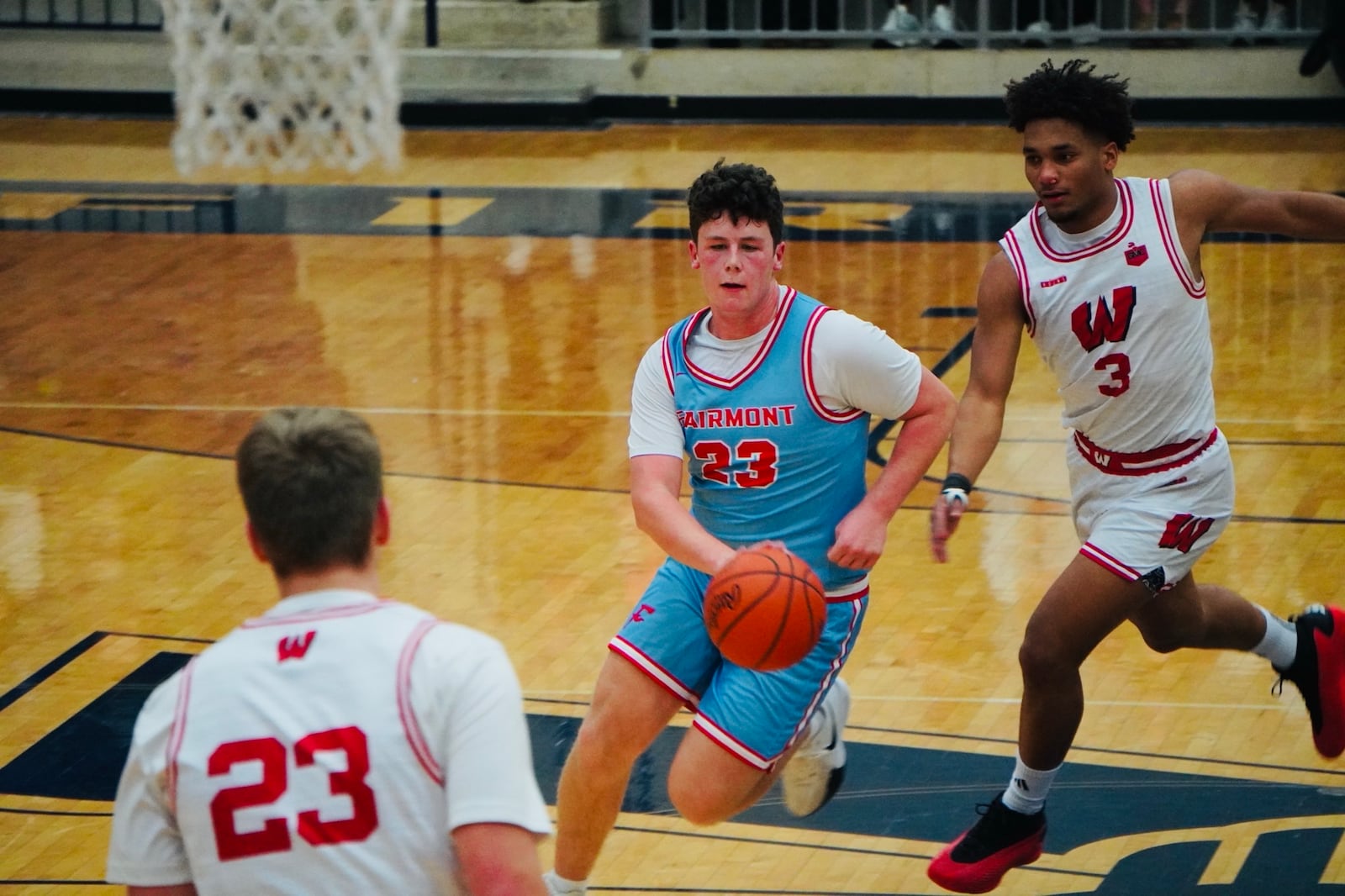 Fairmont's Evan Gentile (24) dribbles through the Lakota West defense at the 22nd Annual The Beacon Orthopedics Flyin’ to the Hoop Invitational on Monday night at Trent Arena. Chris Vogt/CONTRIBUTED