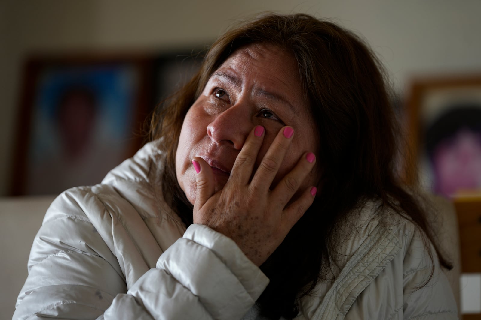 Luyeva Yangali cries during an interview about her father, who disappeared in Ayacucho in 1983 during Peru's internal armed conflict, in Lima, Peru, Sunday, Oct. 20, 2024. (AP Photo/Guadalupe Pardo)