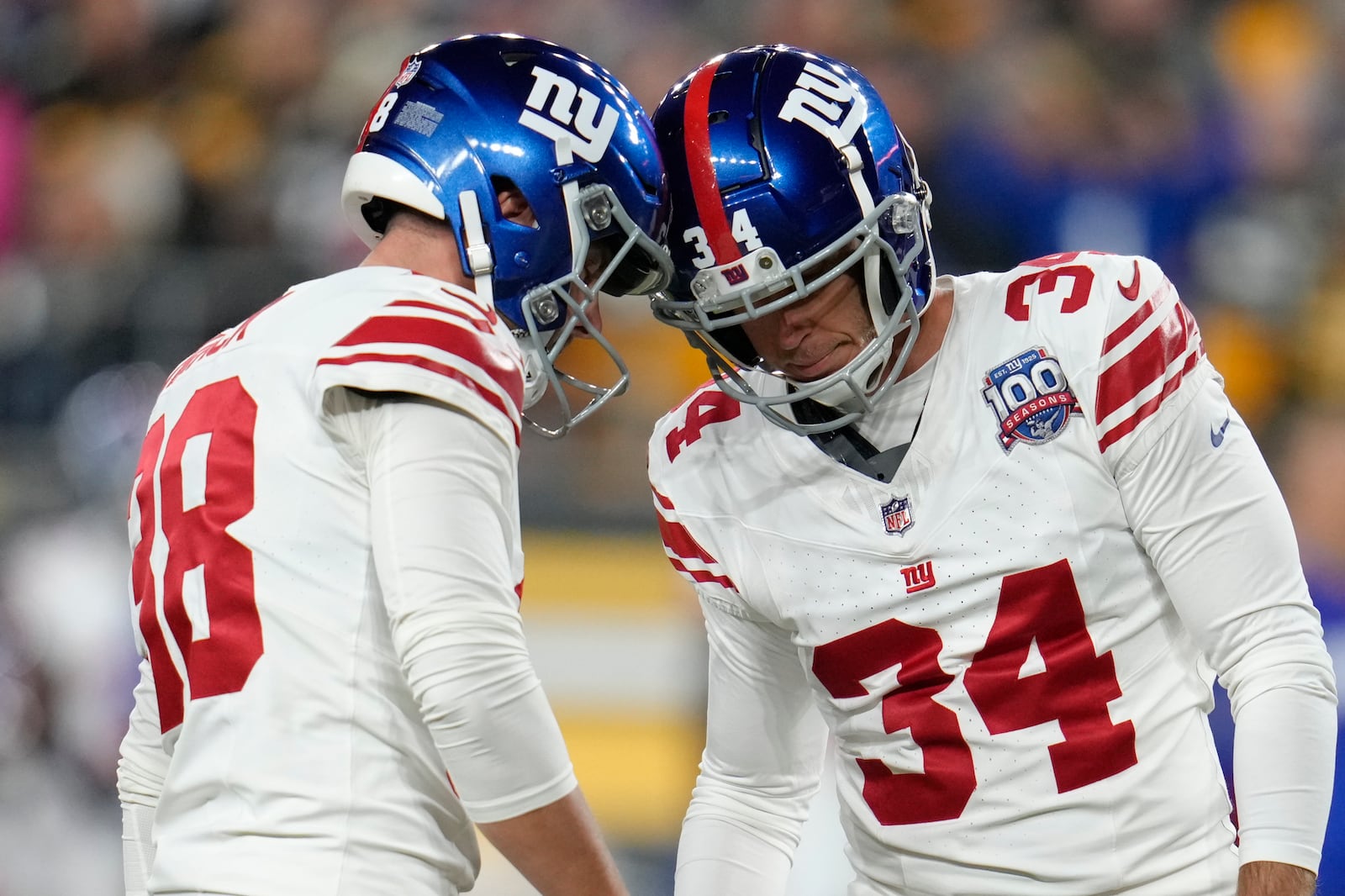 New York Giants place kicker Greg Joseph, right, celebrates with place holder Matt Haack after field goal during the first half of an NFL football game Monday, Oct. 28, 2024, in Pittsburgh. (AP Photo/Gene J. Puskar)