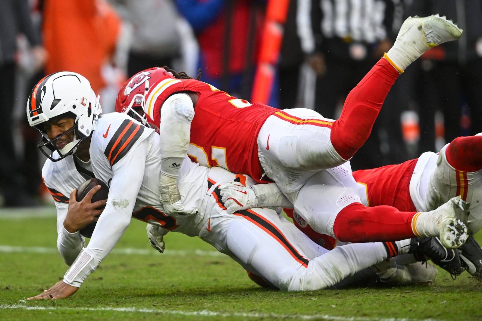 Kansas City Chiefs linebacker Nick Bolton (32) sacks Cleveland Browns quarterback Jameis Winston (5) during the second half of an NFL football game, Sunday, Dec. 15, 2024, in Cleveland. (AP Photo/David Richard)