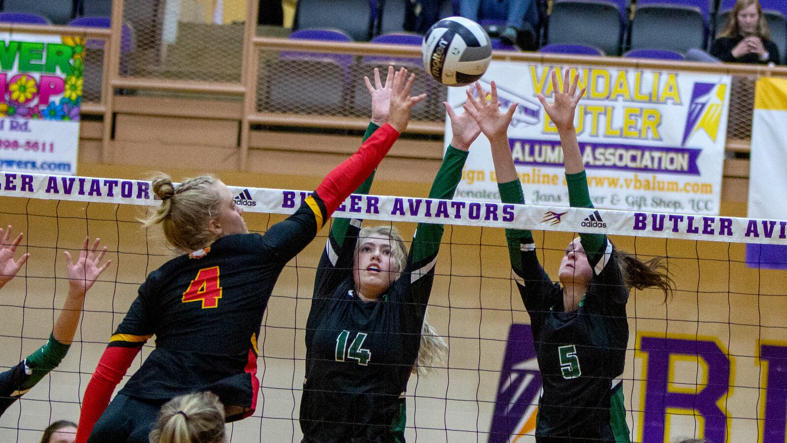 Badin's Lauren Christie (7) and Olivia Schmidt attempt to block a hit by Fenwick's Payton Deidesheimer during Thursday night's Division II region semifinal at Vandalia Butler High School. Badin won in five sets. Jeff Gilbert/CONTRIBUTED