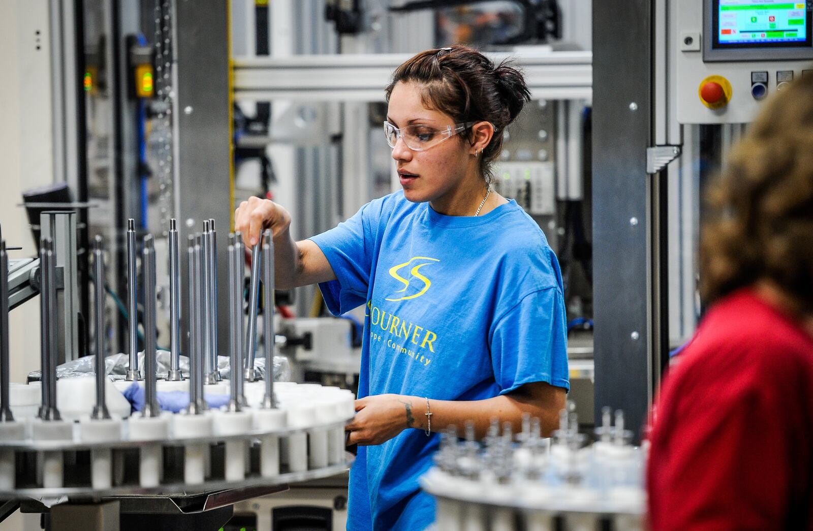 Janet Ayala works in the M300 assembly section where robots are used for certain parts of the assembly process Thursday, April 20 at ThyssenKrupp Bilstein in Hamilton. 