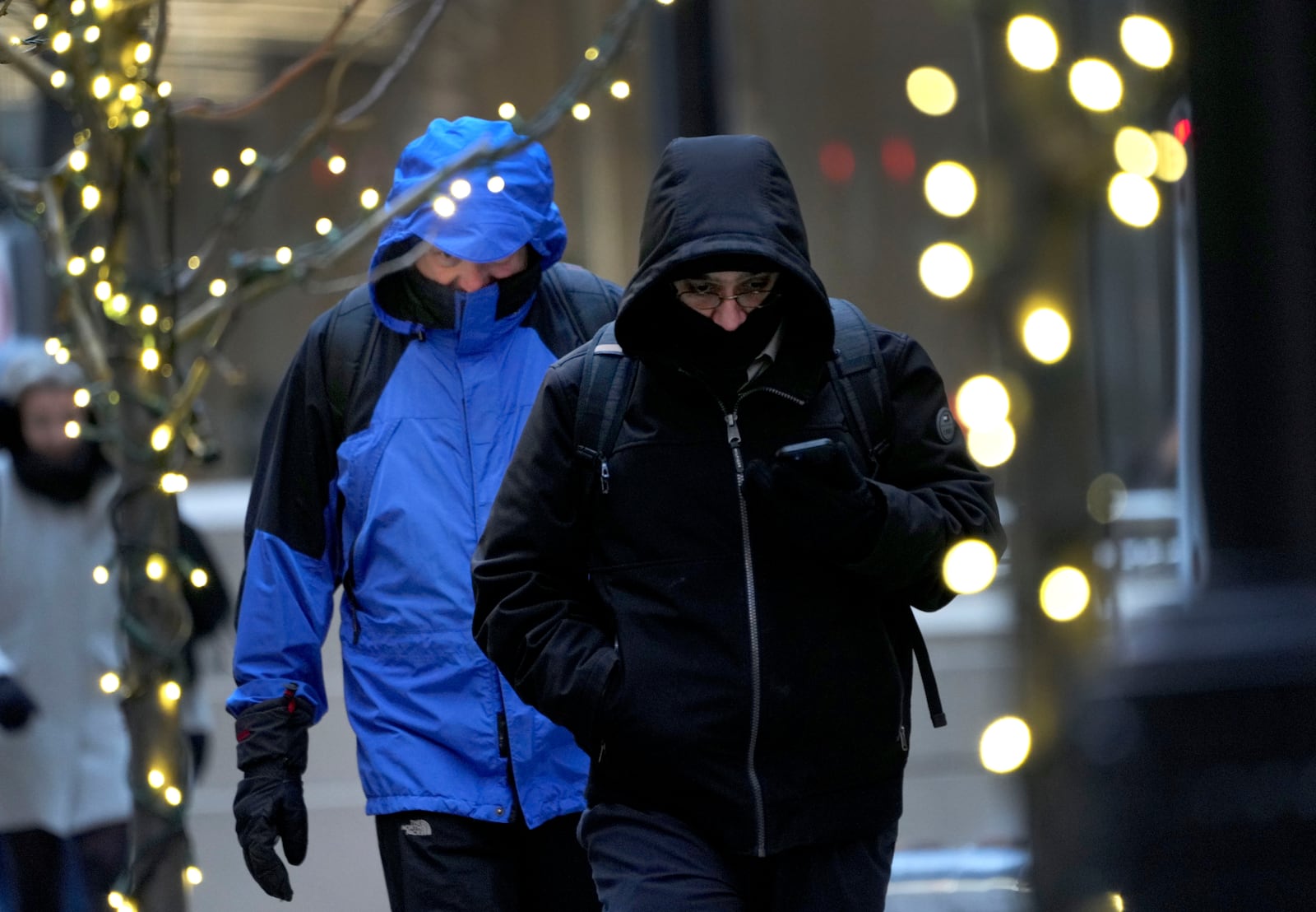 Commuters head to work as an Arctic blast brings single-digit temperatures with wind chills below zero on Thursday, Dec. 12, 2024, in Chicago. (AP Photo/Charles Rex Arbogast)