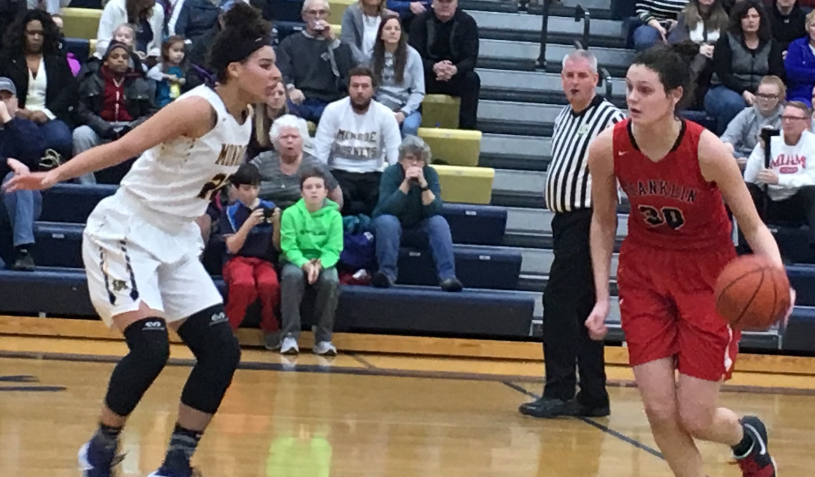 Monroe’s Jahsalyn Robinson stays in front of Franklin’s Layne Ferrell during Saturday night’s game at Monroe. RICK CASSANO/STAFF