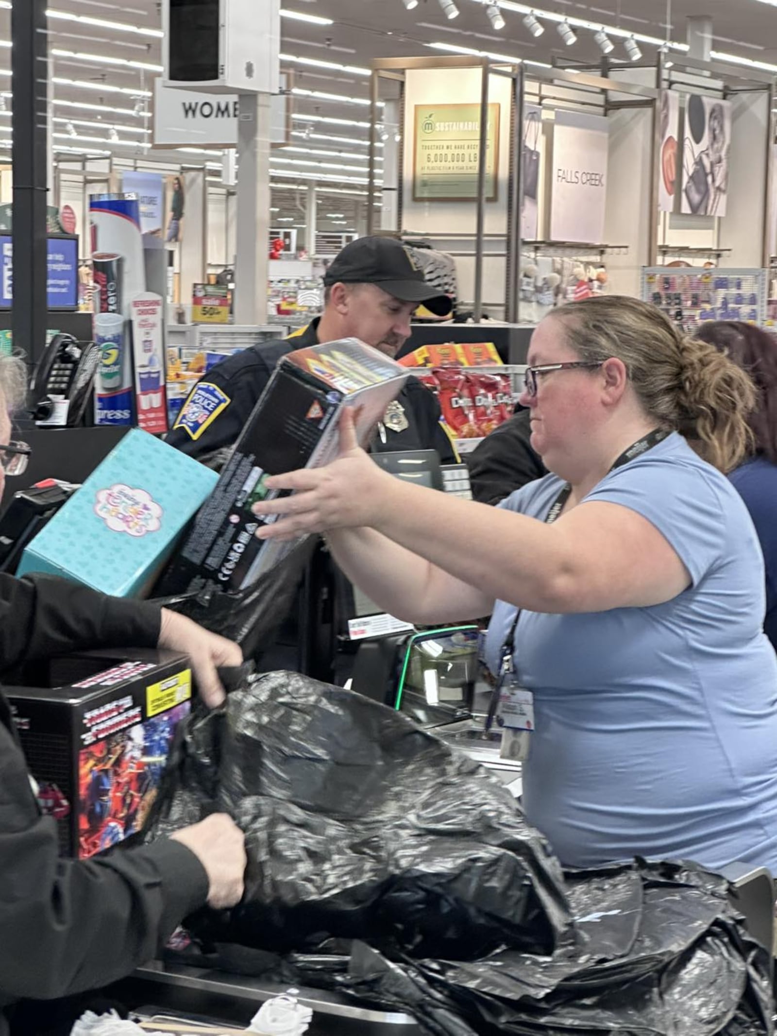 The decades old annual Mike Davis Shop With a Cop happened Saturday with 70 kids and Middletown police employees hitting the isles for Christmas presents. MIDDLETOWN DIVISION OF POLICE