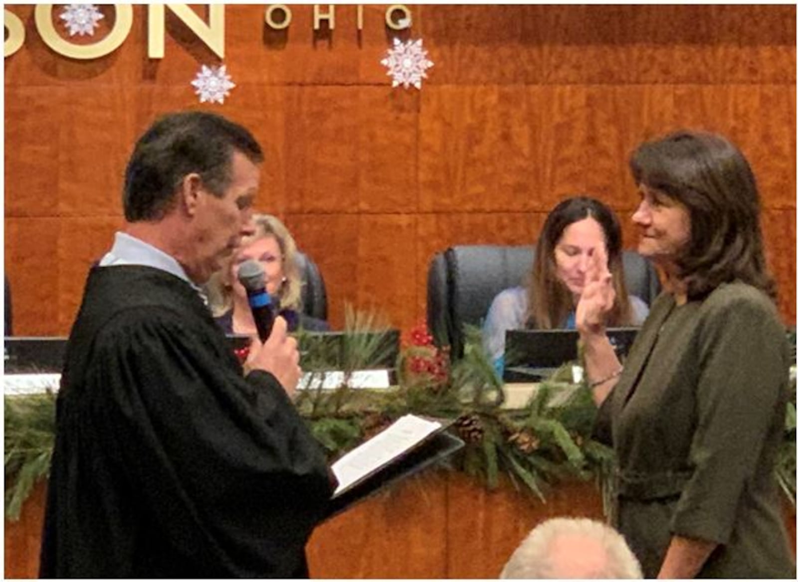 Barbara Spaeth, right, takes the oath of office as the mayor of Mason from Warren County Common Pleas Judge Timothy Tepe on Wednesday. After a two-year hiatus, Spaeth was re-elected to a third four-year term on Mason City Council.  Her fellow council members unanimously selected her as mayor during council's reorganization meeting. Spaeth previous served as council member from 2011 to 2019. ED RICHTER/STAFF