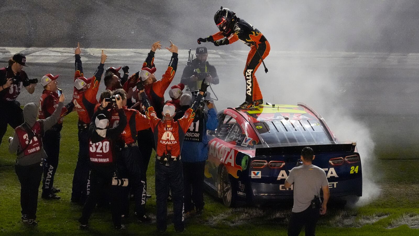 William Byron, on car, celebrates with his pit crew after winning the NASCAR Daytona 500 auto race Sunday, Feb. 16, 2025, at Daytona International Speedway in Daytona Beach, Fla. (AP Photo/Chris O'Meara)