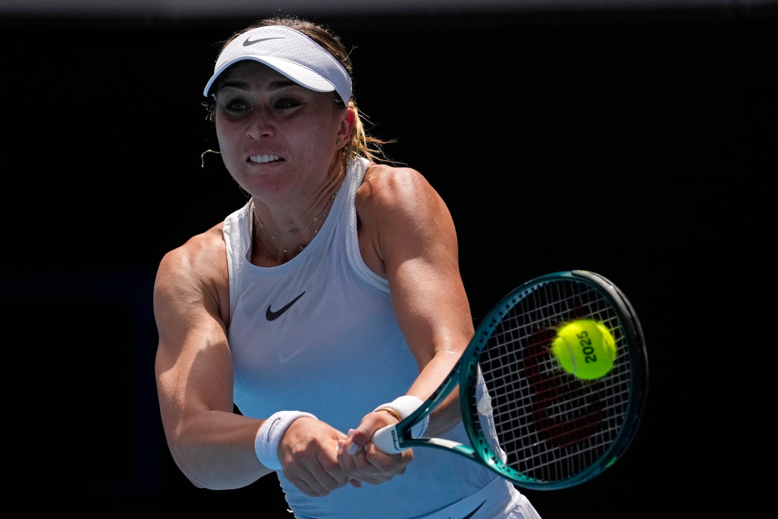 Paula Badosa of Spain returns a shot from Olga Danilovic of Serbia during their fourth round match at the Australian Open tennis championship in Melbourne, Australia, Sunday, Jan. 19, 2025. (AP Photo/Vincent Thian)