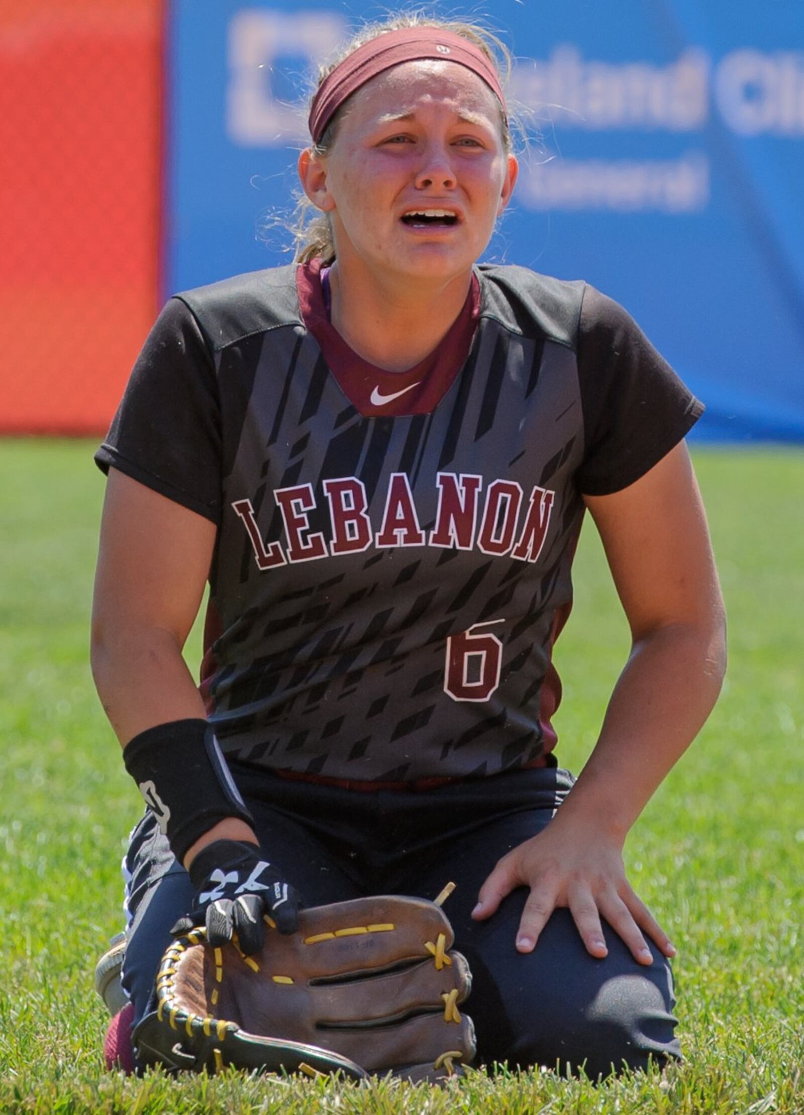 Lebanon left fielder Chole Allen shows her emotions after Elyria scored the winning runs in the bottom of the seventh inning Saturday during the Division I state final at Firestone Stadium in Akron. CONTRIBUTED PHOTO BY BRYANT BILLING