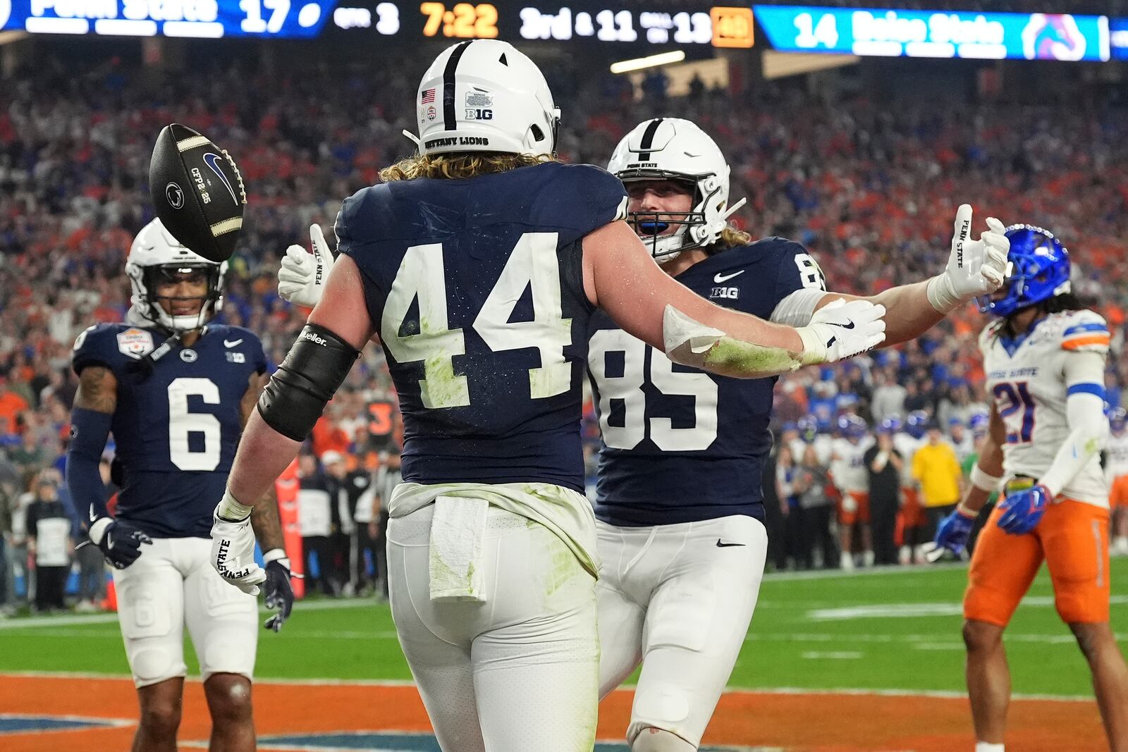 Penn State tight end Tyler Warren (44) celebrates his touchdown against Boise State defends during the second half of the Fiesta Bowl College Football Playoff game, Tuesday, Dec. 31, 2024, in Glendale, Ariz. (AP Photo/Ross D. Franklin)