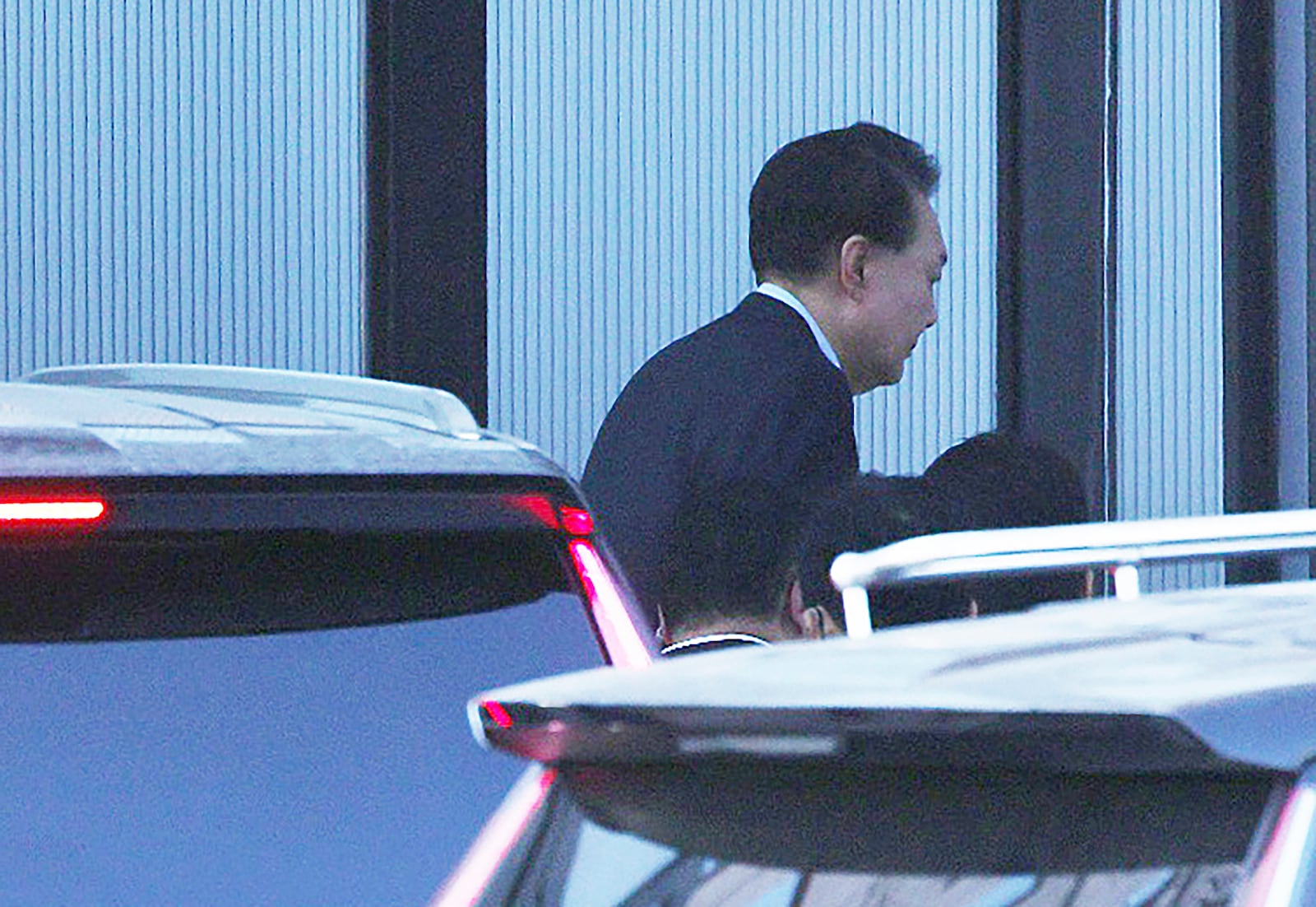 Impeached South Korean President Yoon Suk Yeol arrives at the Corruption Investigation Office for High-ranking Officials in Gwacheon, South Korea, Wednesday, Jan. 15, 2025. (Korea Pool via AP)