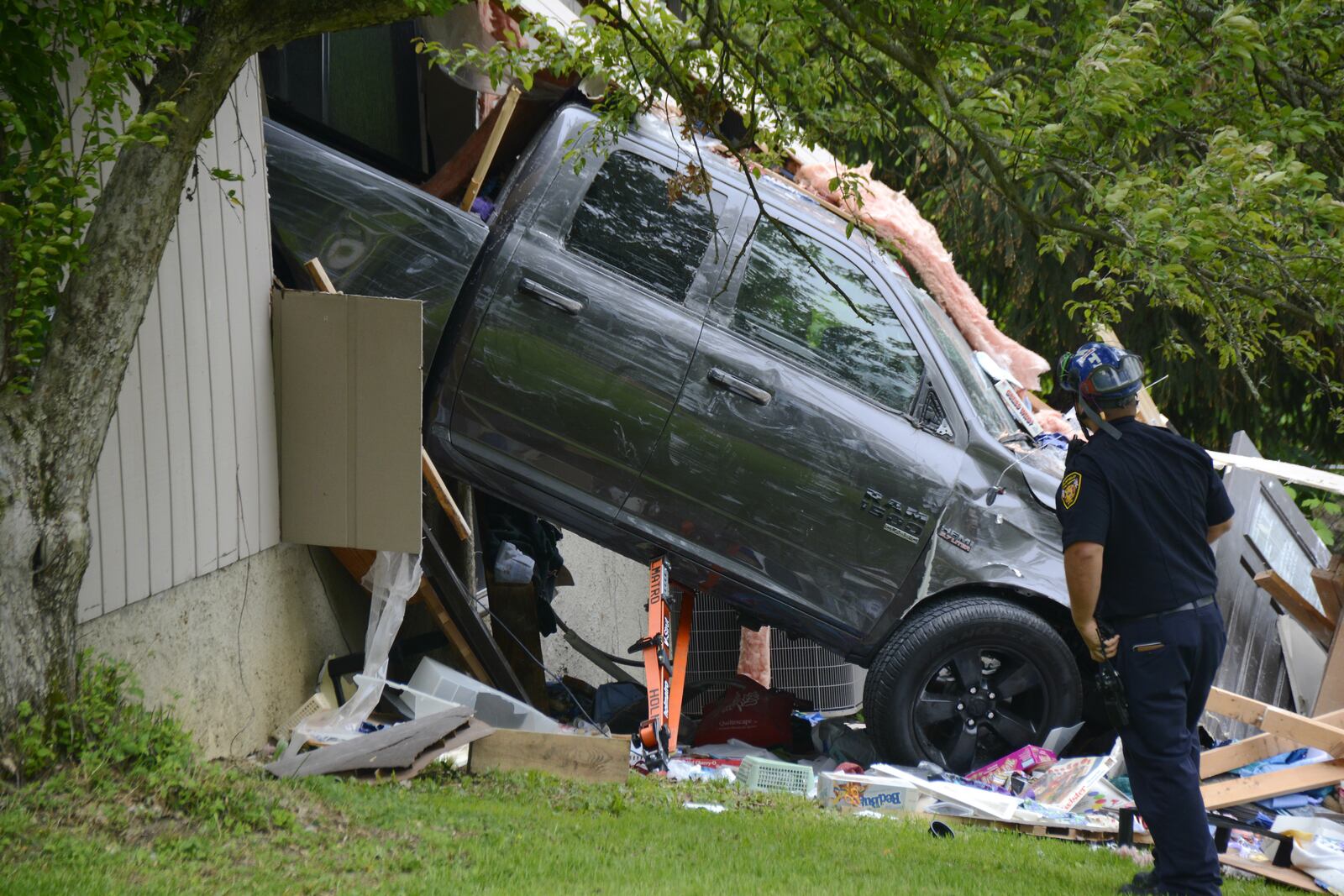 A male driver blacked out and lost control of a pickup truck on Thursday, may 9, 2019, which went through a house on Spruce Hill Drive near Barrett and West Chester roads in West Chester Twp. MICHAEL D. PITMAN/STAFF