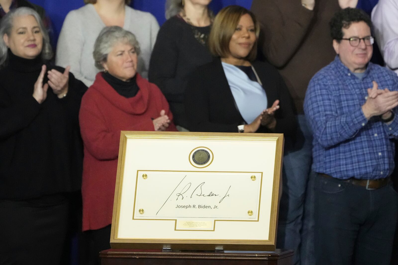 President Joe Biden is being inducted into the Labor Hall of Honor at the Department of Labor in Washington, Monday, Dec. 16, 2024. (AP Photo/Mark Schiefelbein)