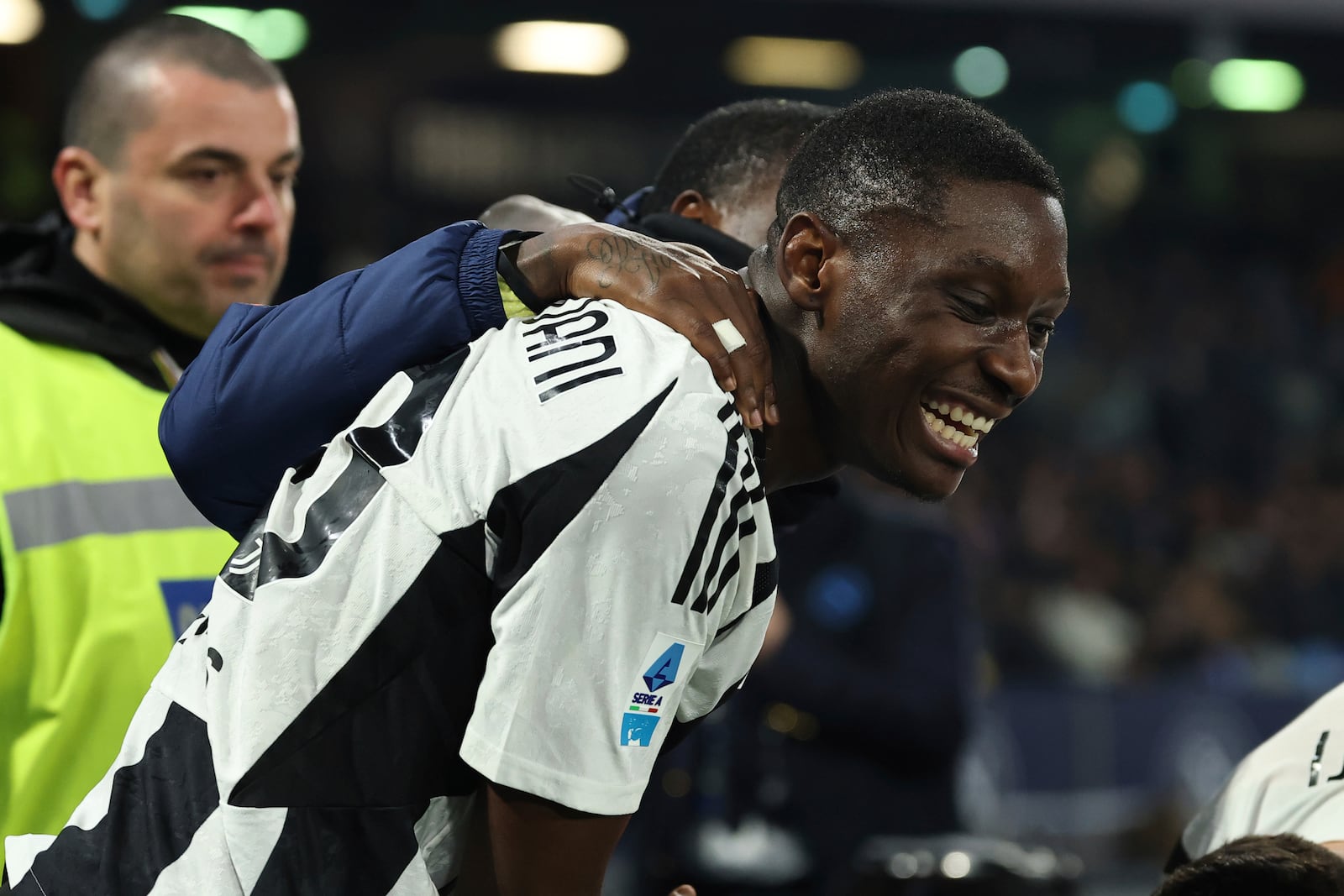 Juventus' Randal Kolo Muani, center, celebrates after scoring the team's first goal during the Serie A soccer match between Napoli and Juventus at the Diego Armando Maradona Stadium in Naples, Italy, Saturday Jan. 25, 2025. (Alessandro Garofalo/LaPresse via AP)