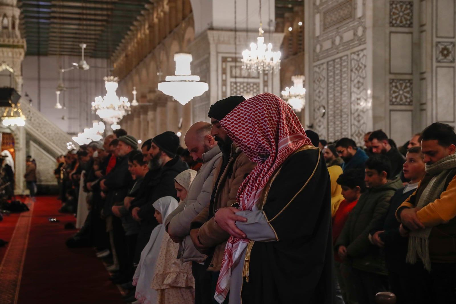 Muslim worshippers pray on the first day of the Muslim holy month of Ramadan at the Umayyad Mosque in Damascus, Syria, Saturday March 1, 2025.(AP Photo/Omar Sanadiki)