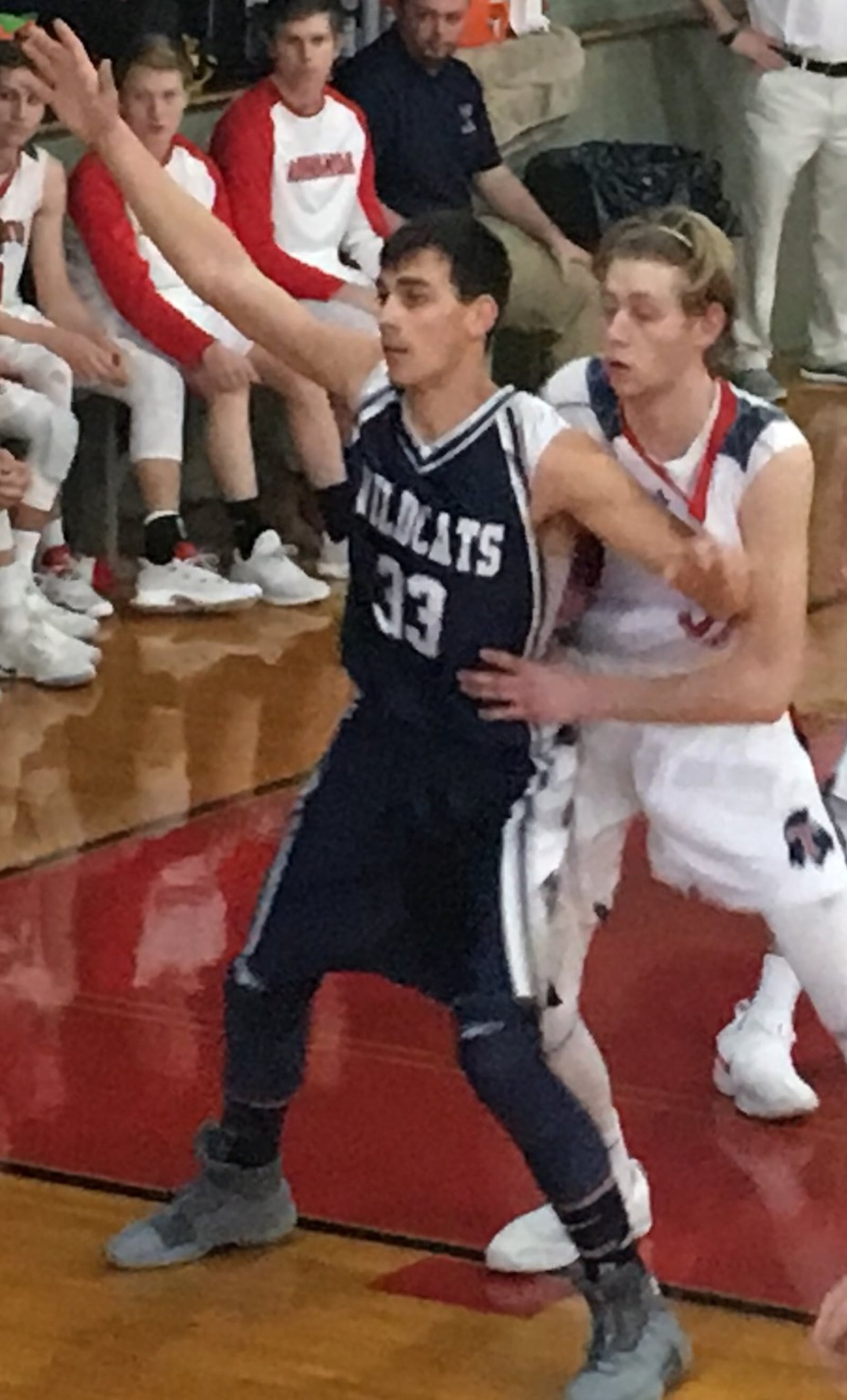 Talawanda’s Josh DeWitt defends Franklin County (Ind.)’s Hunter Mayfield (33) during Saturday afternoon’s game at the Hoosier Gym in Knightstown, Ind. RICK CASSANO/STAFF