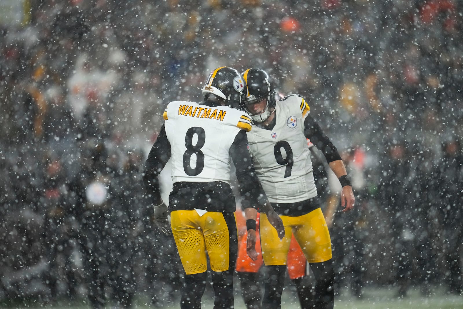 Pittsburgh Steelers place kicker Chris Boswell (9) celebrates with holder Corliss Waitman (8) in the second half of an NFL football game, Thursday, Nov. 21, 2024, in Cleveland. (AP Photo/Sue Ogrocki)