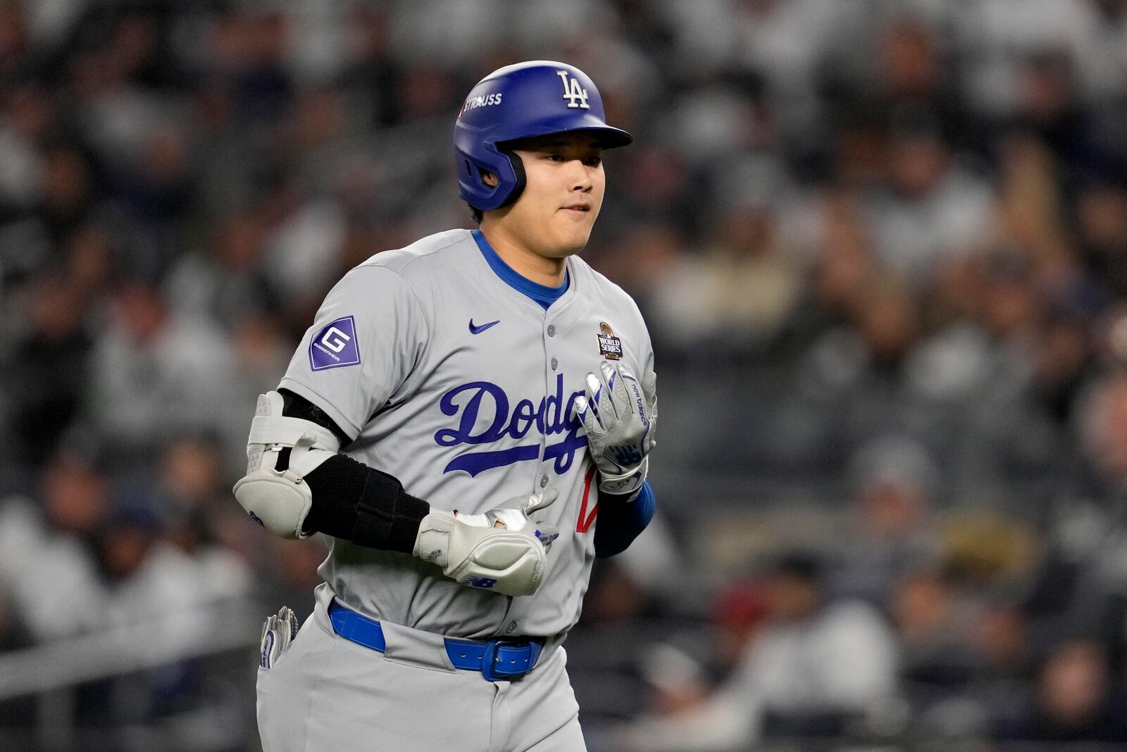 Los Angeles Dodgers' Shohei Ohtani walks to the dugout after a pop out against the New York Yankees during the seventh inning in Game 3 of the baseball World Series, Monday, Oct. 28, 2024, in New York. (AP Photo/Ashley Landis)