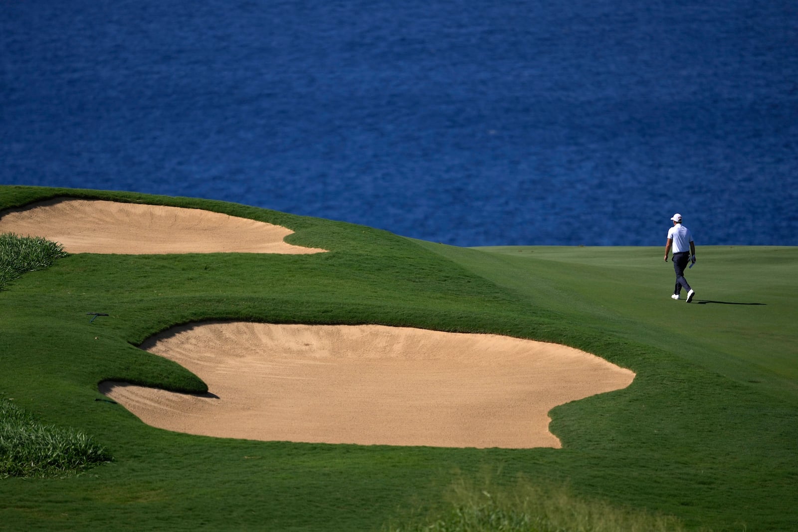 Tom Hoge walks up the 12th fairway during the second round of The Sentry golf event, Friday, Jan. 3, 2025, at the Kapalua Plantation Course in Kapalua, Hawaii. (AP Photo/Matt York)