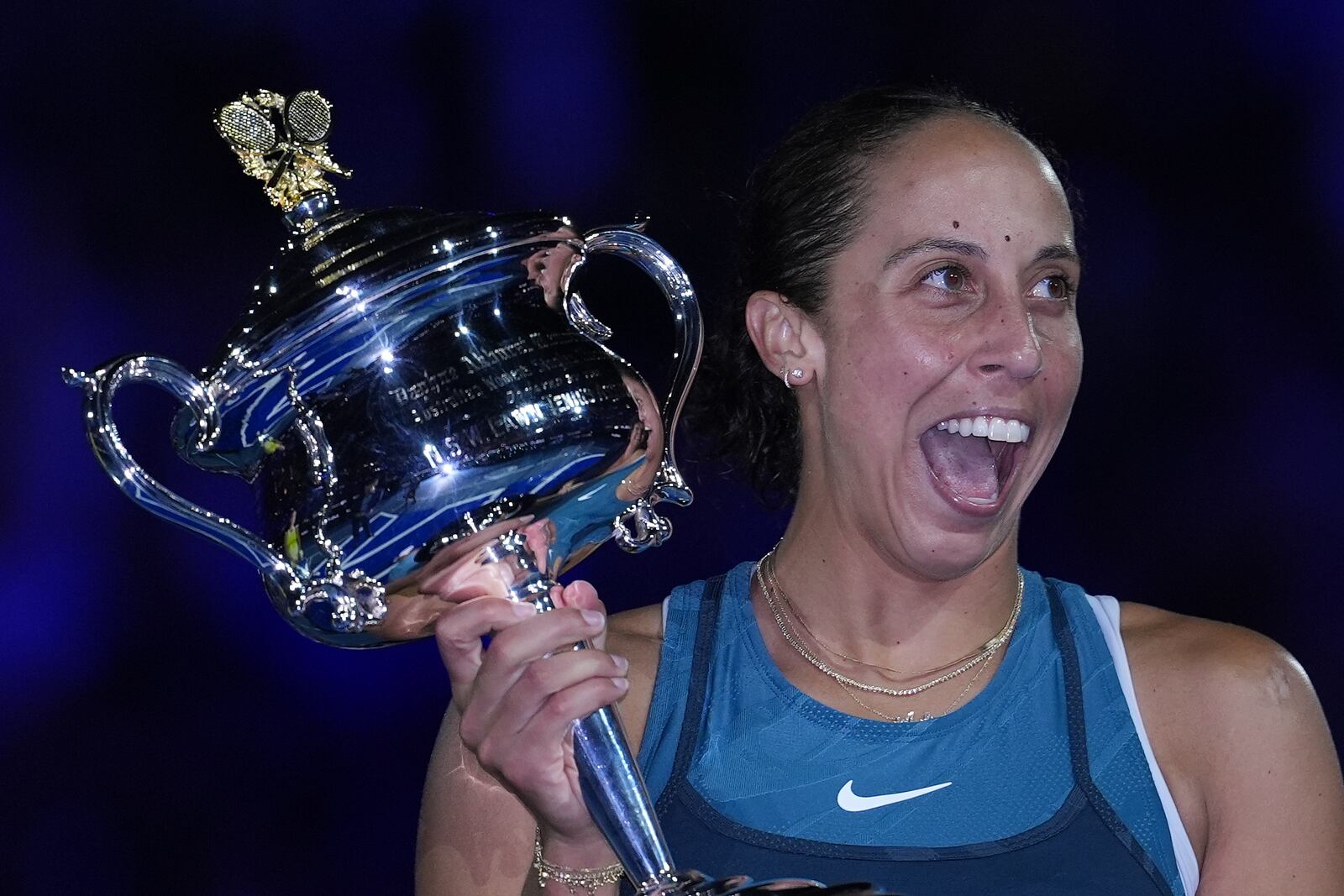 Madison Keys of the U.S. reacts as she receives the the Daphne Akhurst Memorial Cup from Evonne Goolagong Cawley after defeating Aryna Sabalenka of Belarus in the women's singles final at the Australian Open tennis championship in Melbourne, Australia, Saturday, Jan. 25, 2025. (AP Photo/Ng Han Guan)