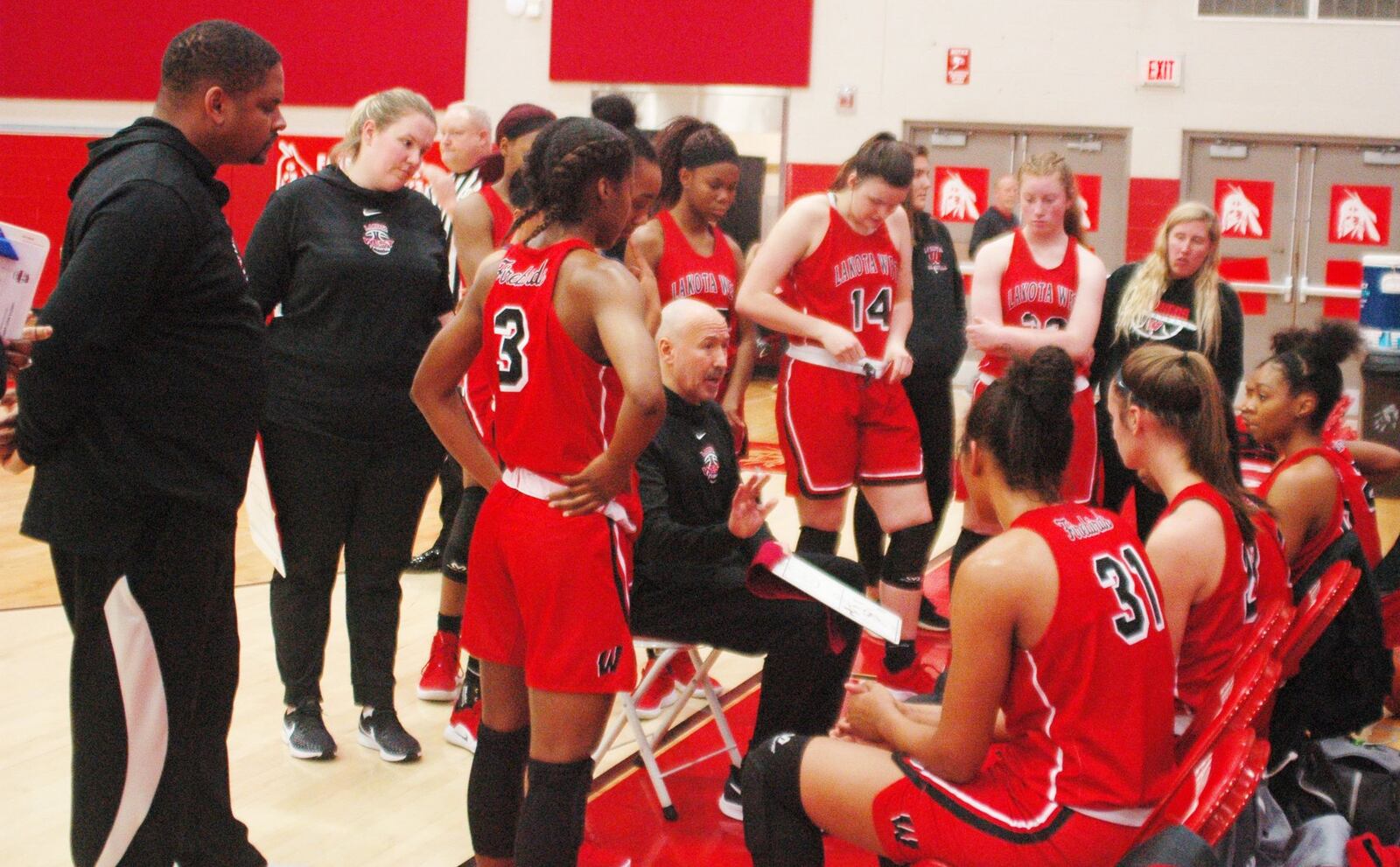 Lakota West coach Andy Fishman talks to his team during a timeout at Fairfield on Dec. 1, 2018. RICK CASSANO/STAFF