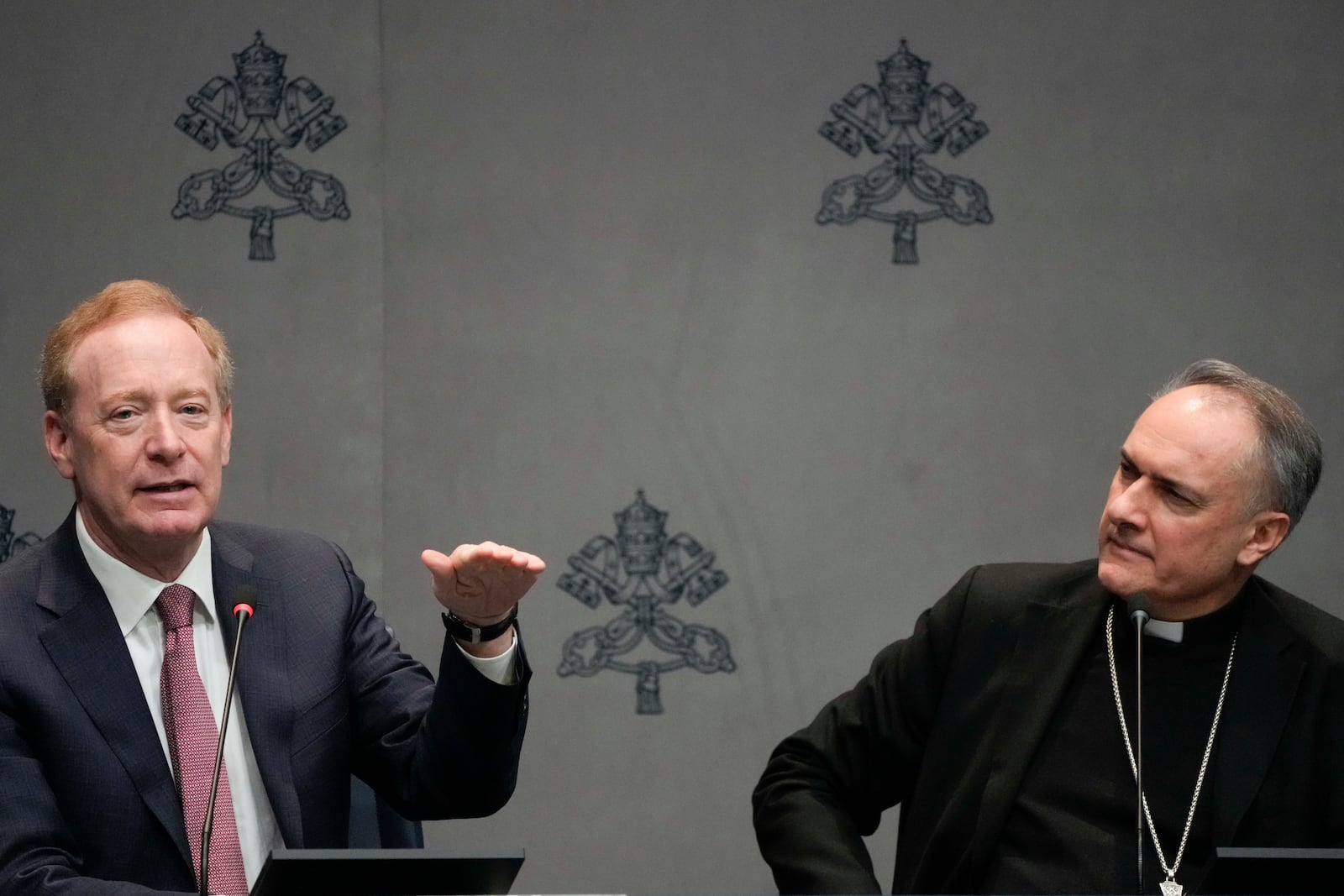 Cardinal Mauro Gambetti, right, and Microsoft's vice-Chairman and President Brad Smith unveil the project "St. Peter's Basilica: AI-Enhanced Experience" during a press conerence. at the Vatican, Monday, Nov. 11, 2024. (AP Photo/Gregorio Borgia)