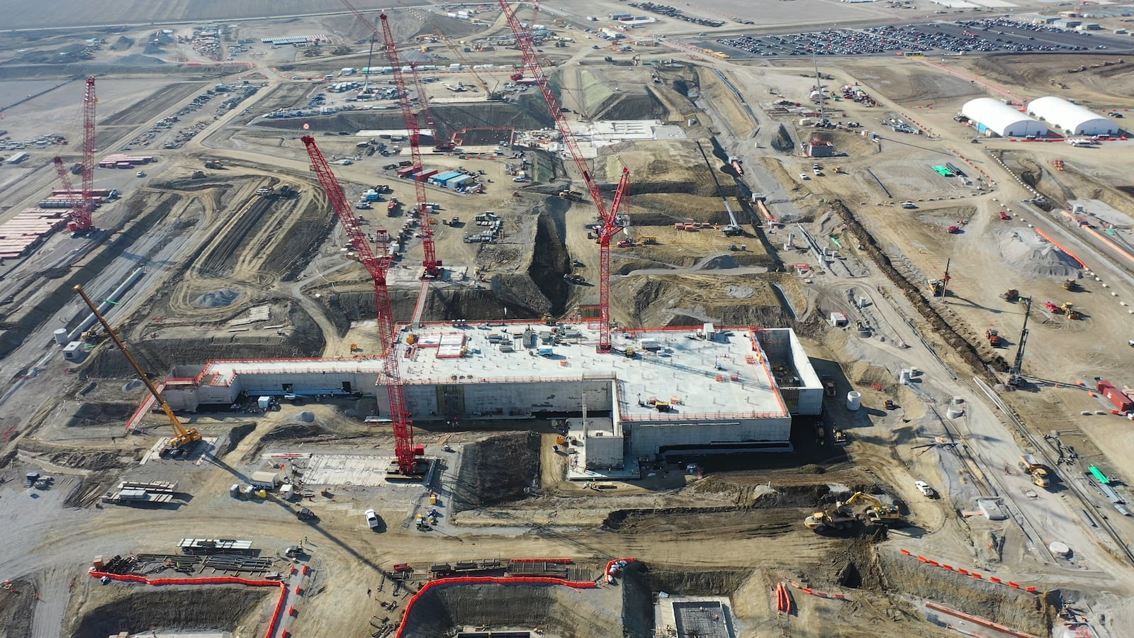 An aerial view from February 2024 shows construction progress at Intel's Ohio One campus in New Albany, Ohio. The company is investing $28 billion to build two semiconductor fabrication plants on the site, which spans nearly 1,000 acres. The company broke ground in September 2022. (Credit: Intel Corporation)