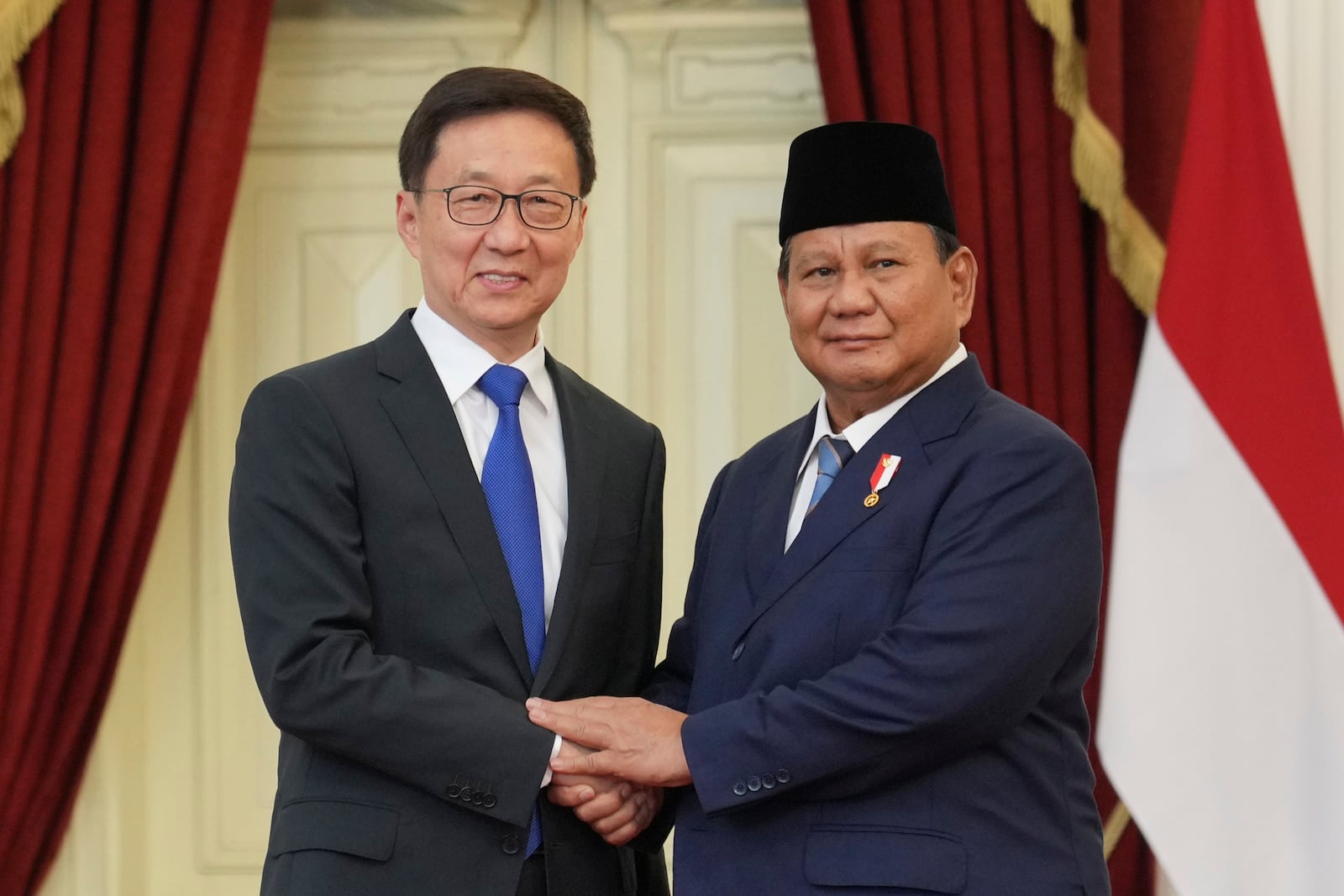 FILE - Indonesia's new President Prabowo Subianto, right, greets China's Vice President Han Zheng during their meeting after Subianto's inauguration, at Merdeka Palace in Jakarta, Indonesia on Oct. 20, 2024. (AP Photo/Achmad Ibrahim, Pool, File)