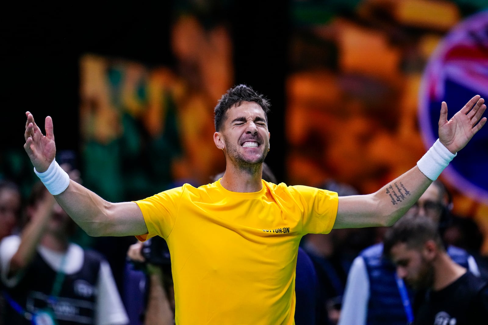 Australia's Athanasios Kokkinakis celebrates after winning against Ben Shelton of the United States during a Davis Cup quarterfinal match at the Martin Carpena Sports Hall, in Malaga, southern Spain, on Thursday, Nov. 21, 2024. (AP Photo/Manu Fernandez)