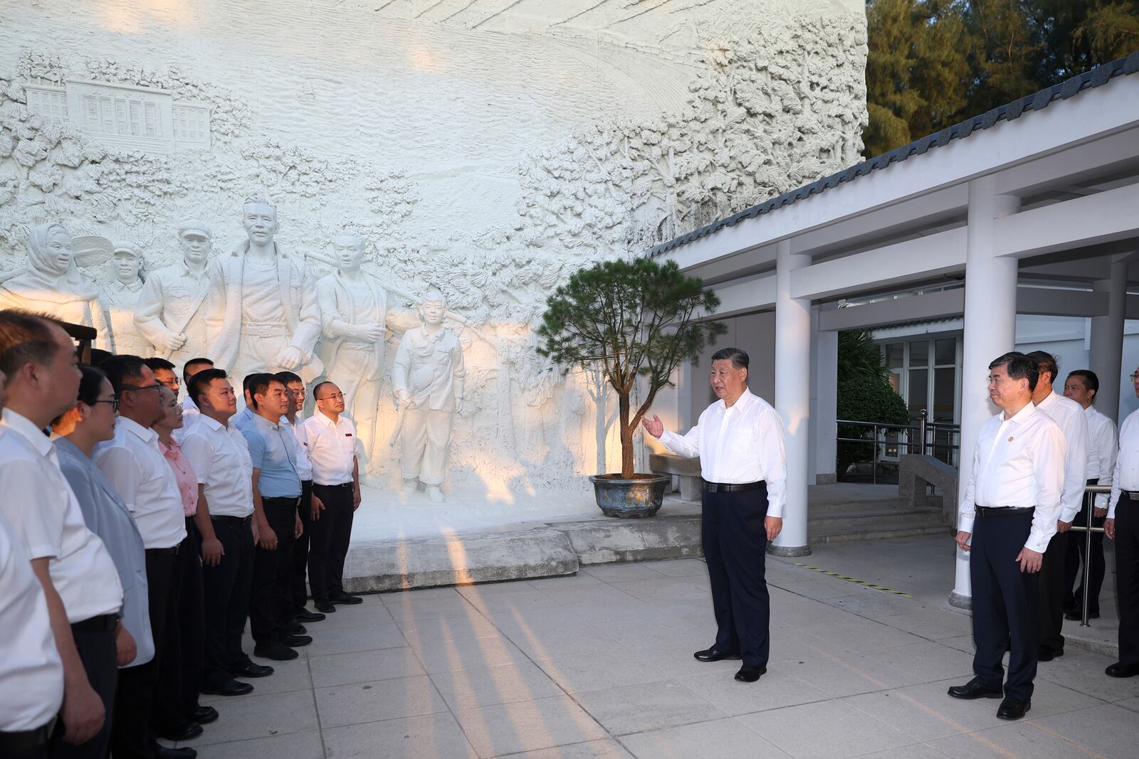 In this photo released by Xinhua News Agency, Chinese President Xi Jinping, cneter, visits the Gu Wenchang memorial hall in Dongshan County in the city of Zhangzhou during an inspection tour in southeastern China's Fujian province on Tuesday, Oct. 15, 2024. (Ju Peng/Xinhua via AP)