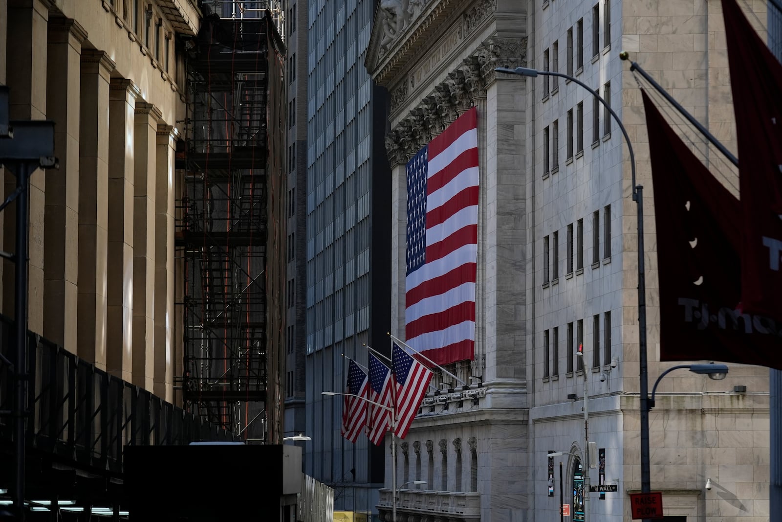 An American flag is displayed on the outside of the New York Stock Exchange in New York, Wednesday, Feb. 26, 2025. (AP Photo/Seth Wenig)