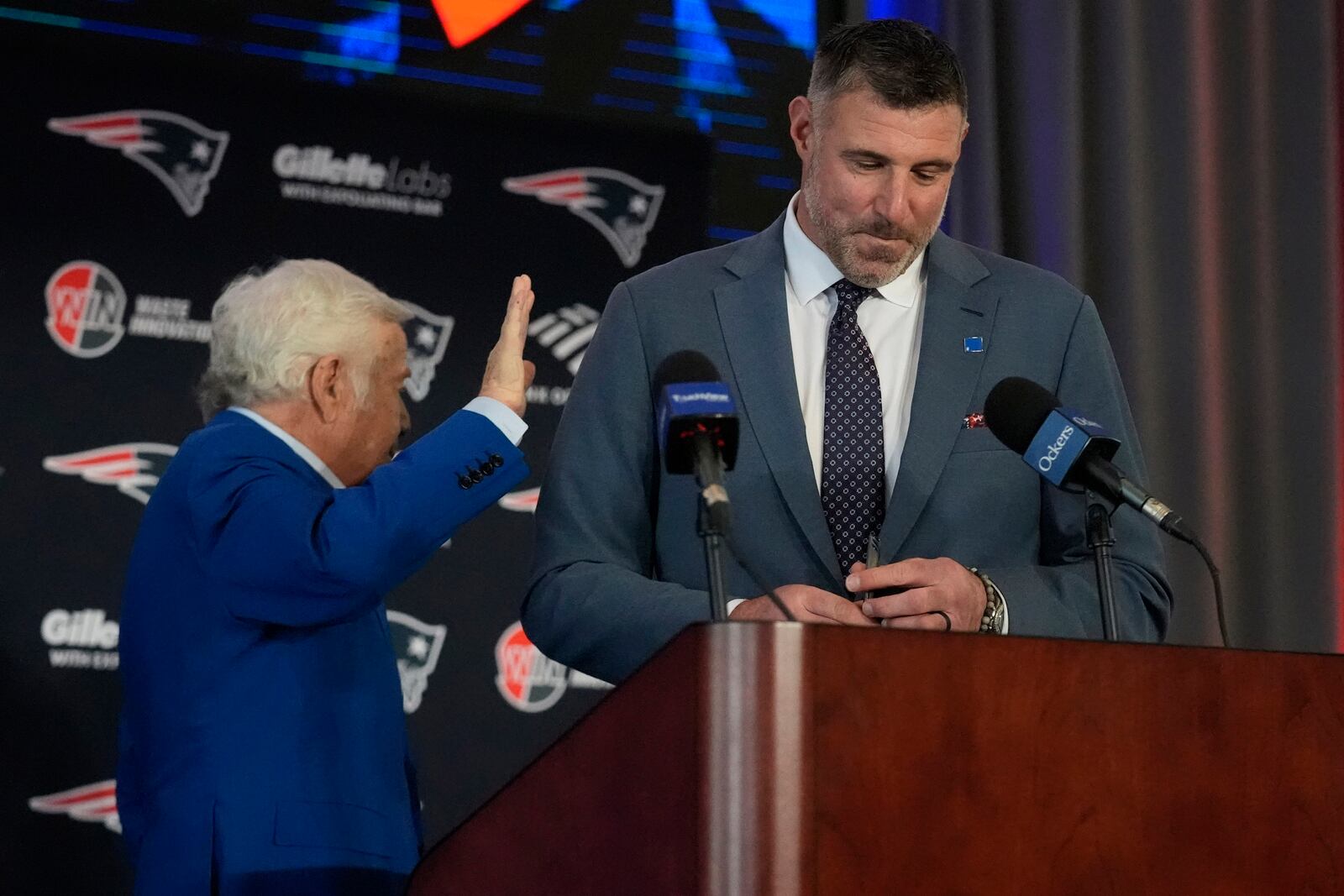 New England Patriots head coach Mike Vrabel, right, gets a pat on the back by team owner Robert Kraft while being introduced during an availability, Monday, Jan. 13, 2025, in Foxborough, Mass. (AP Photo/Charles Krupa)