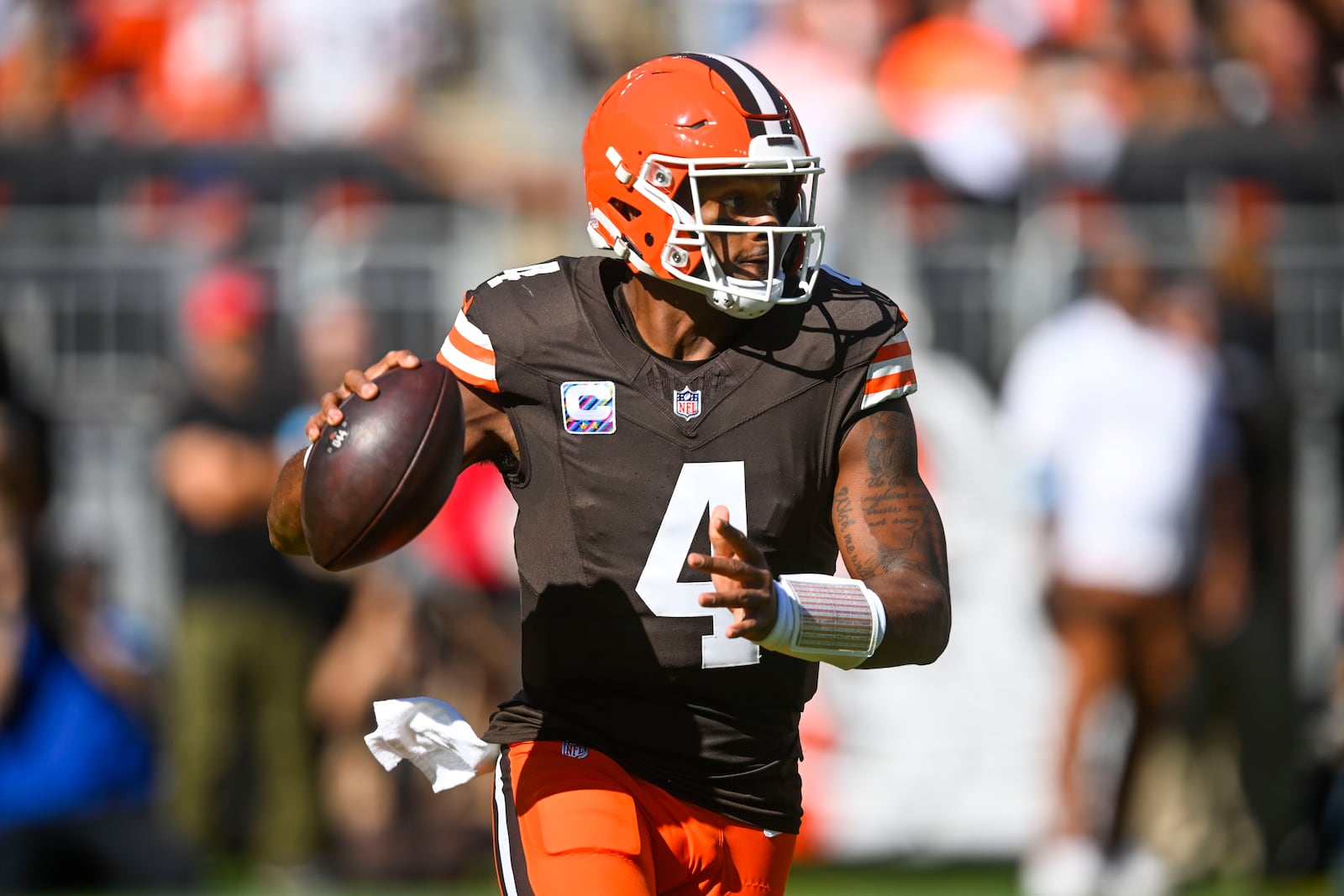 Cleveland Browns quarterback Deshaun Watson (4) scrambles in the first half of an NFL football game against the Cincinnati Bengals, Sunday, Oct. 20, 2024, in Cleveland. (AP Photo/David Richard)