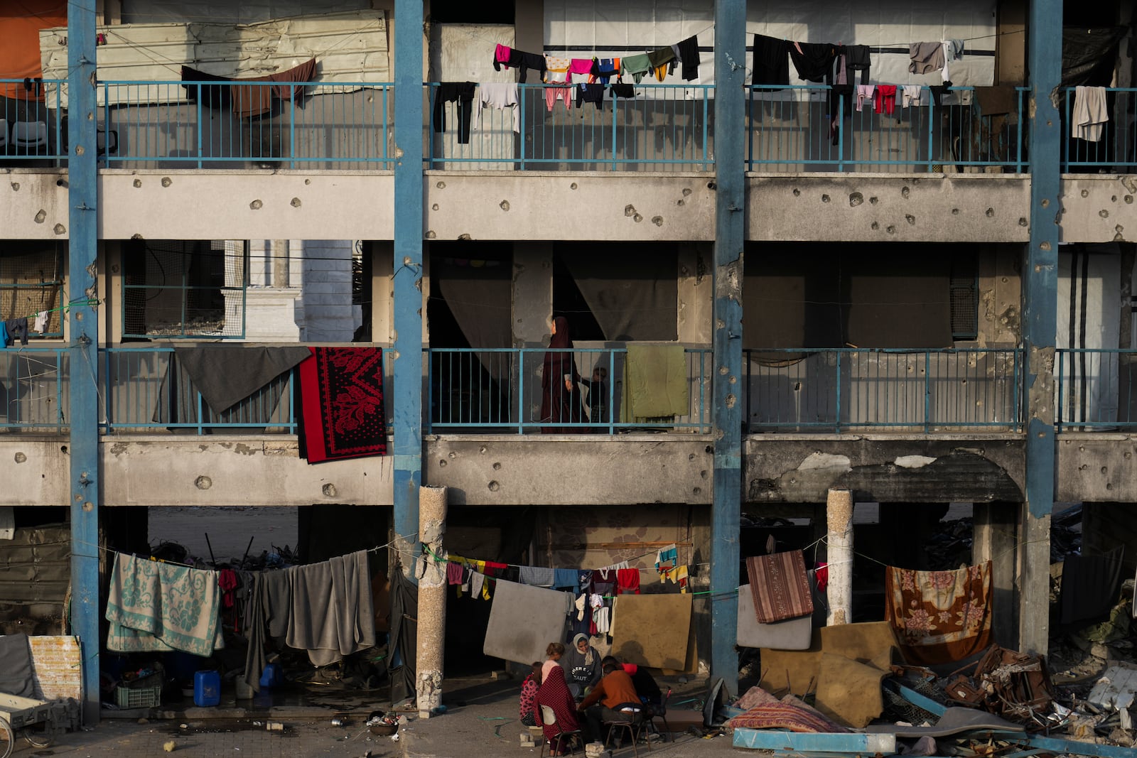 Displaced Palestinians lives in a school run by UNRWA, the U.N. agency helping Palestinian refugees, west of Gaza City, Sunday, March 9, 2025. (AP Photo/Jehad Alshrafi)