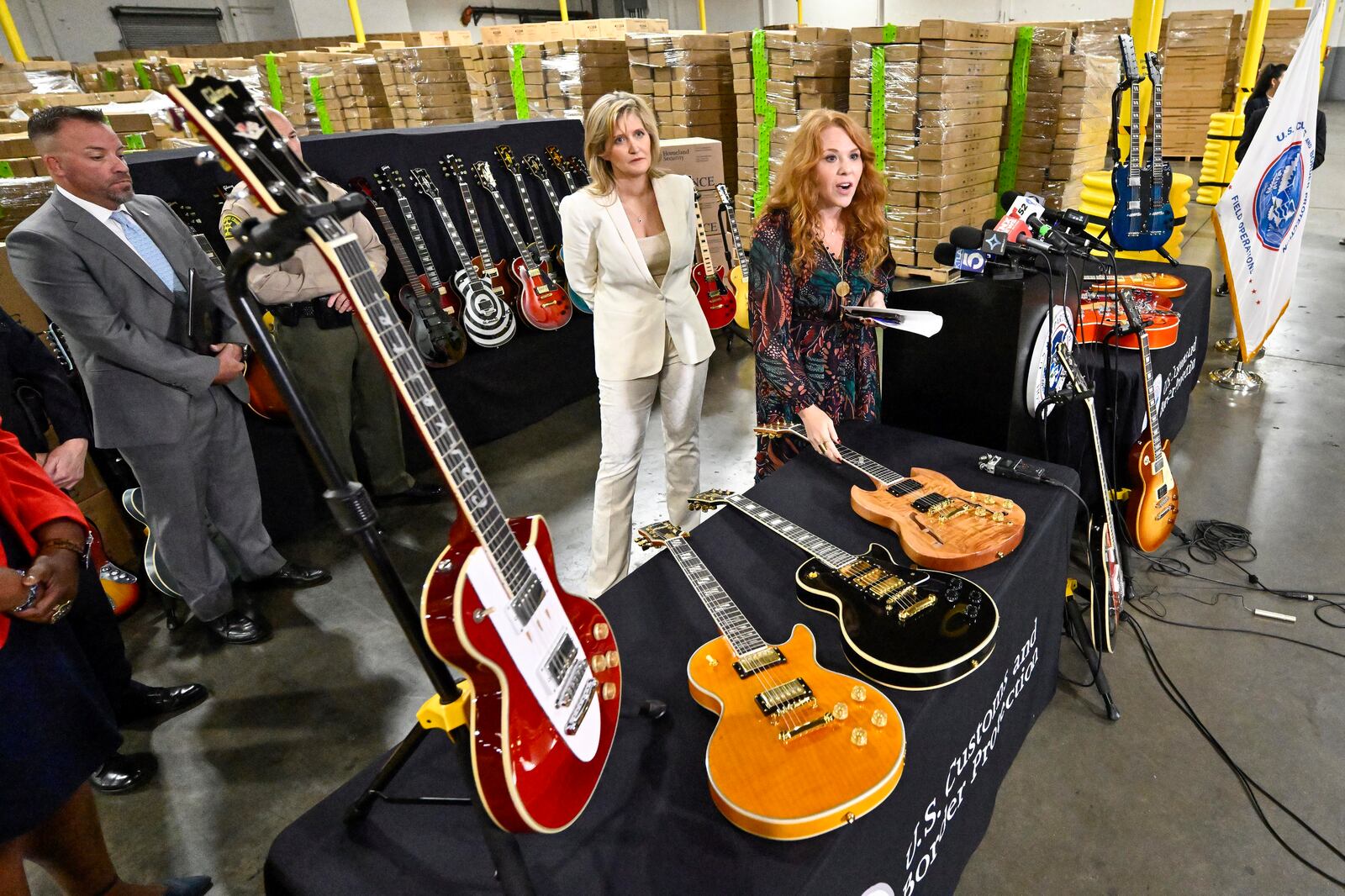 Andrea Bates, attorney for Gibson, left, and Elizabeth "Beth" Heidt, chief marketing officer, Gibson Inc., answer questions during a U.S. Customs and Border Protection press conference after more than 3000 counterfeit Gibson guitars were seized, in Carson, Calif., on Tuesday, Nov. 26, 2024. (Jeff Gritchen/The Orange County Register via AP)